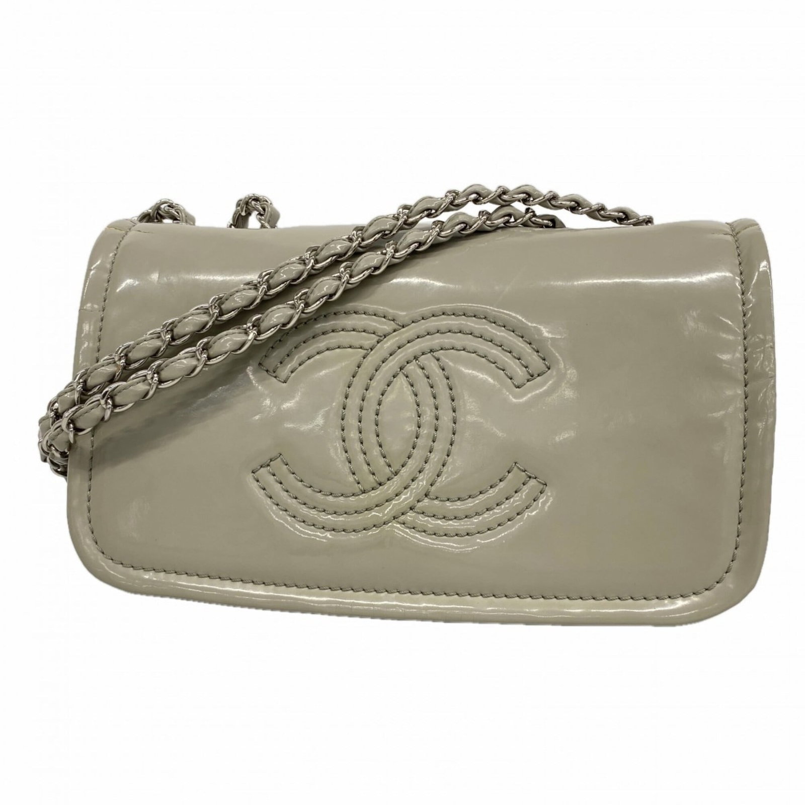 Patent leather shoulder bag by Chanel: Patent leather shoulder bag by Chanel Patent leather shoulder bag by Chanel boasts sleek, sophisticated design with its gray color and silver hardware. Made from high-quality patent leather, the bag m