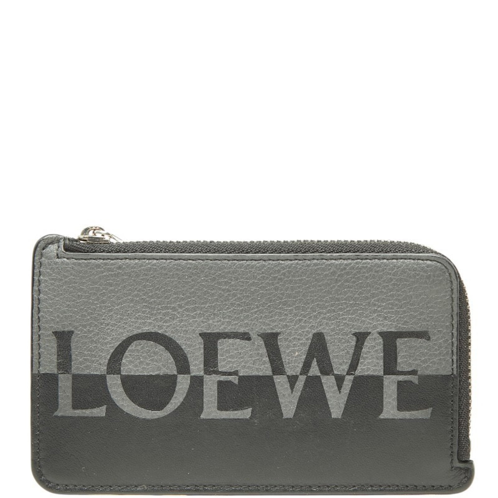 Coin Case Leather Purse Loewe: Coin Case Leather Purse Loewe This sleek Loewe leather purse features a compact design with a subtle black and gray color scheme, measuring 7.5cm x 13cm x 3.00mm. The coin case style showcases the hig