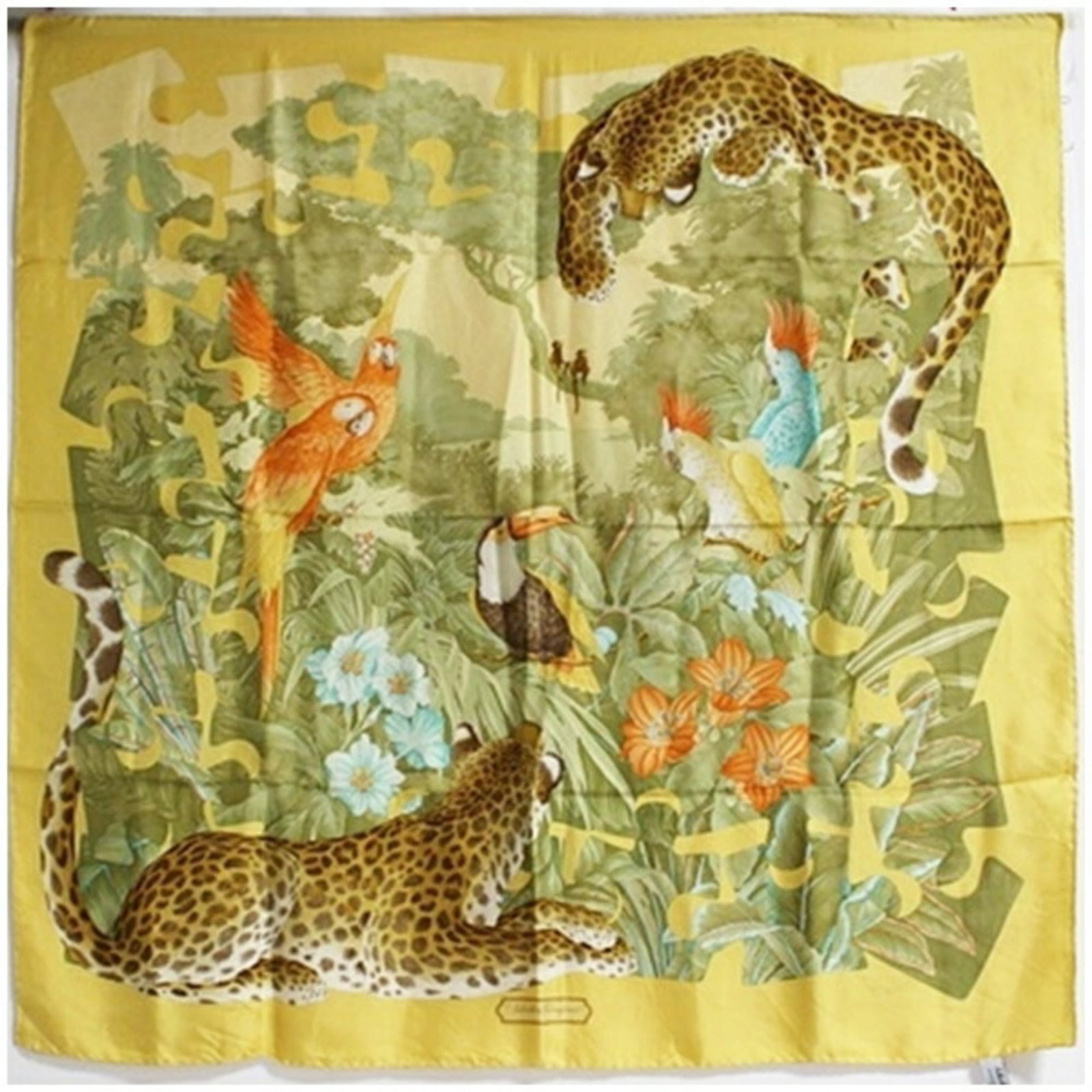 Silk scarf by Salvatore Ferragamo: Silk scarf by Salvatore Ferragamo Silk scarf by Salvatore Ferragamo, featuring a vibrant green and yellow color combination. Made from high-quality silk, the scarf measures 86cm x 84cm in size. A beau