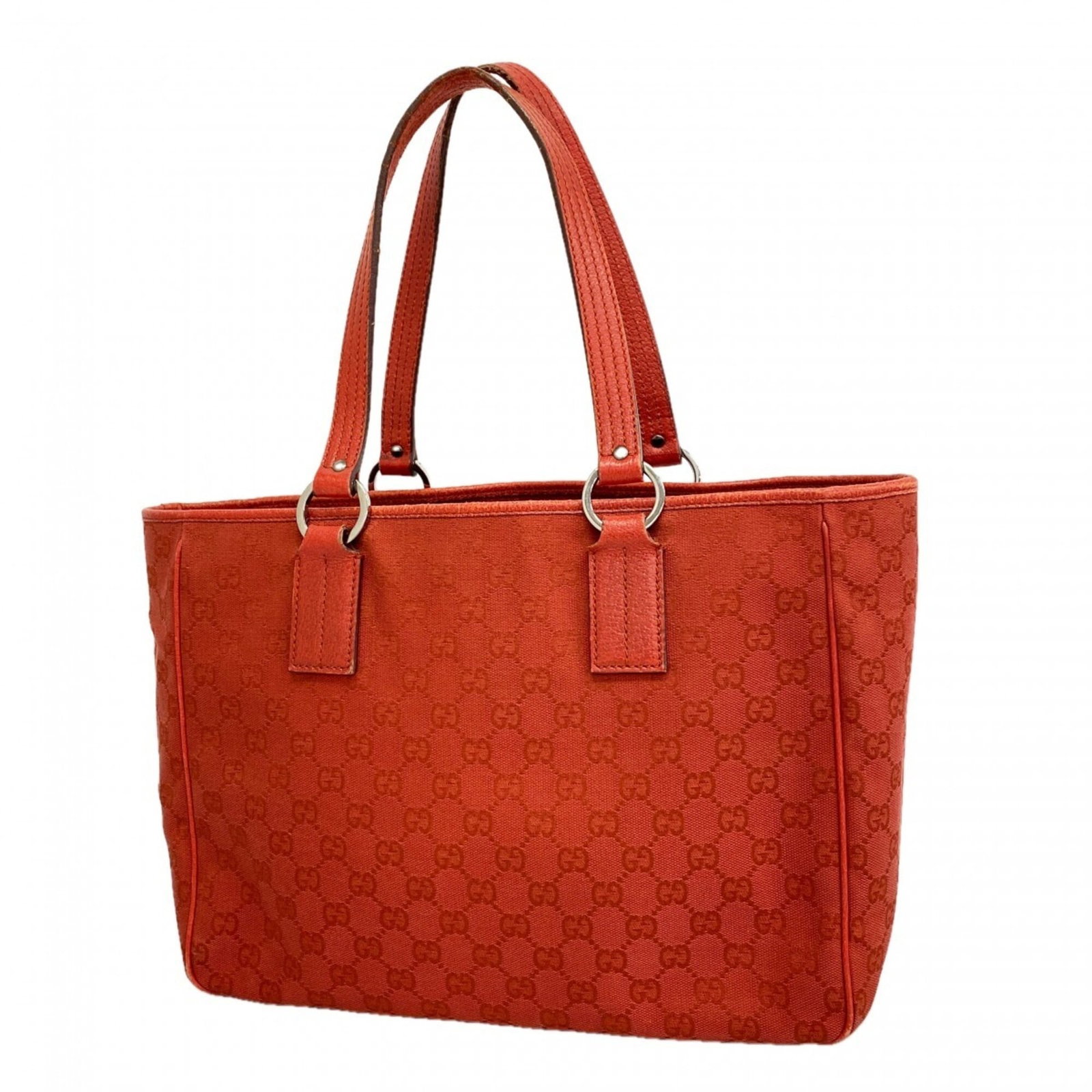 Gucci Tote Bag Canvas: Gucci Tote Bag Canvas The Gucci Tote Bag Canvas features a striking red color and elegant silver hardware, making it a stylish accessory for women. Measuring 25cm x 33cm x 12cm, this canvas tote bag i