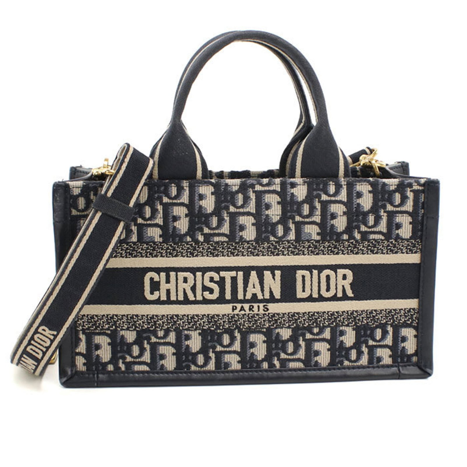 Christian Dior Tote Bag: Christian Dior Tote Bag Navy blue with gold hardware, this Christian Dior tote bag measures 14.5cm x 26.5cm x 9cm and features a sleek design. Made in Italy, it boasts a classic style that is both