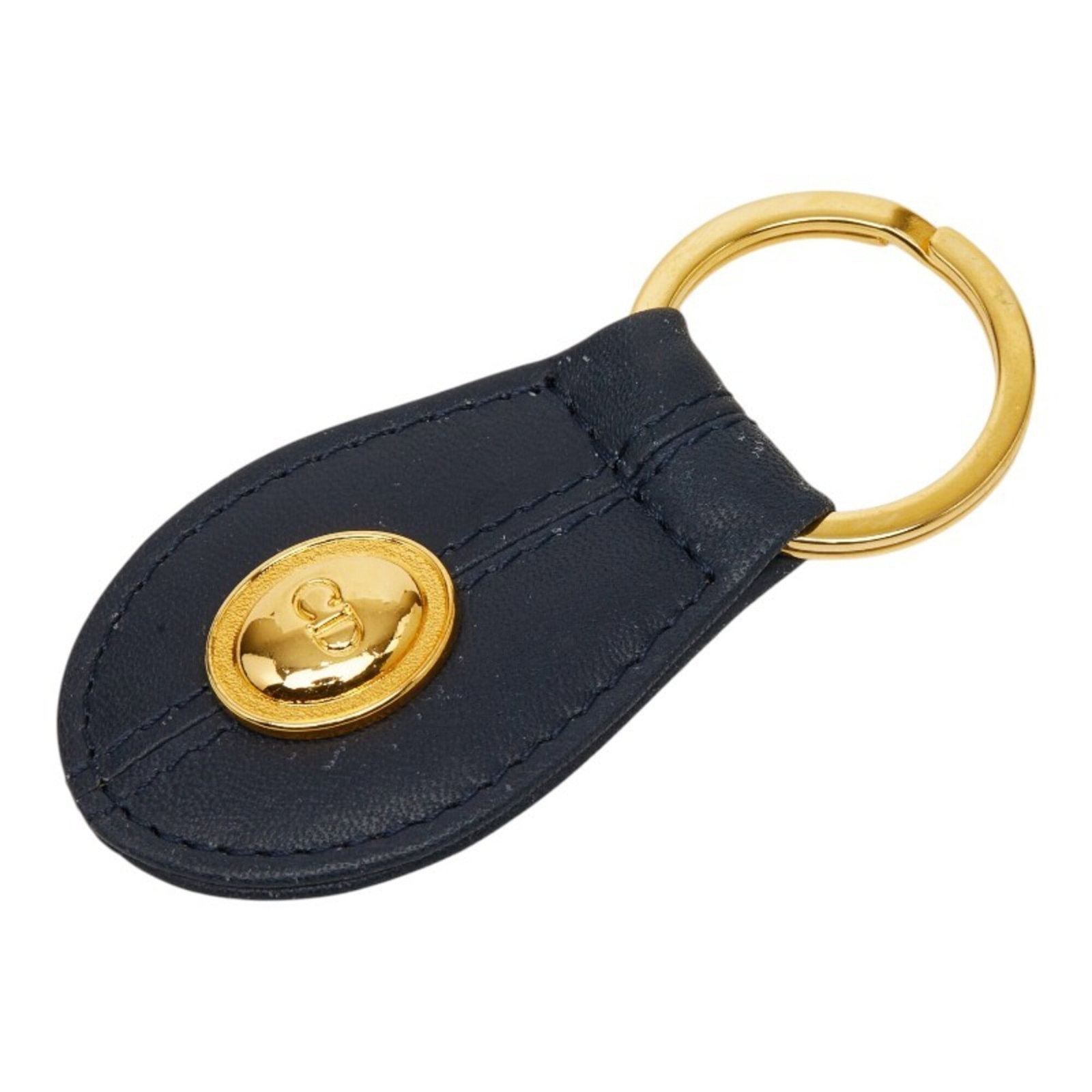 Keyring Leather by Christian Dior: Keyring Leather by Christian Dior Christian Dior's Keyring Leather boasts elegant gold and navy accents, showcasing the luxury brand's signature style. Crafted from high-quality leather, this refined 