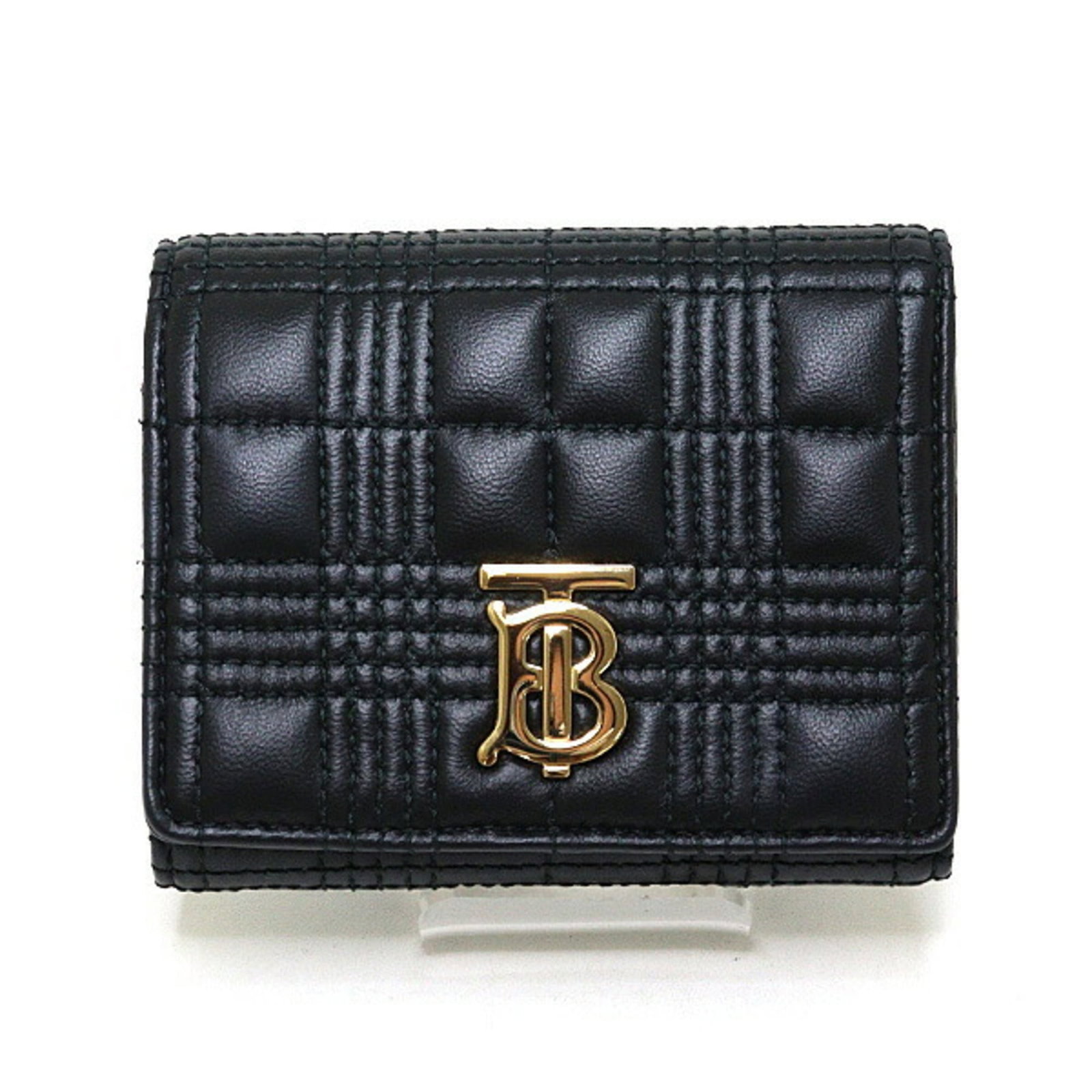 Burberry leather wallet tri fold: Burberry leather wallet tri fold Burberry leather wallet tri fold, crafted from high-quality black leather, features a classic tri-fold design with clean lines and timeless elegance. The item comes