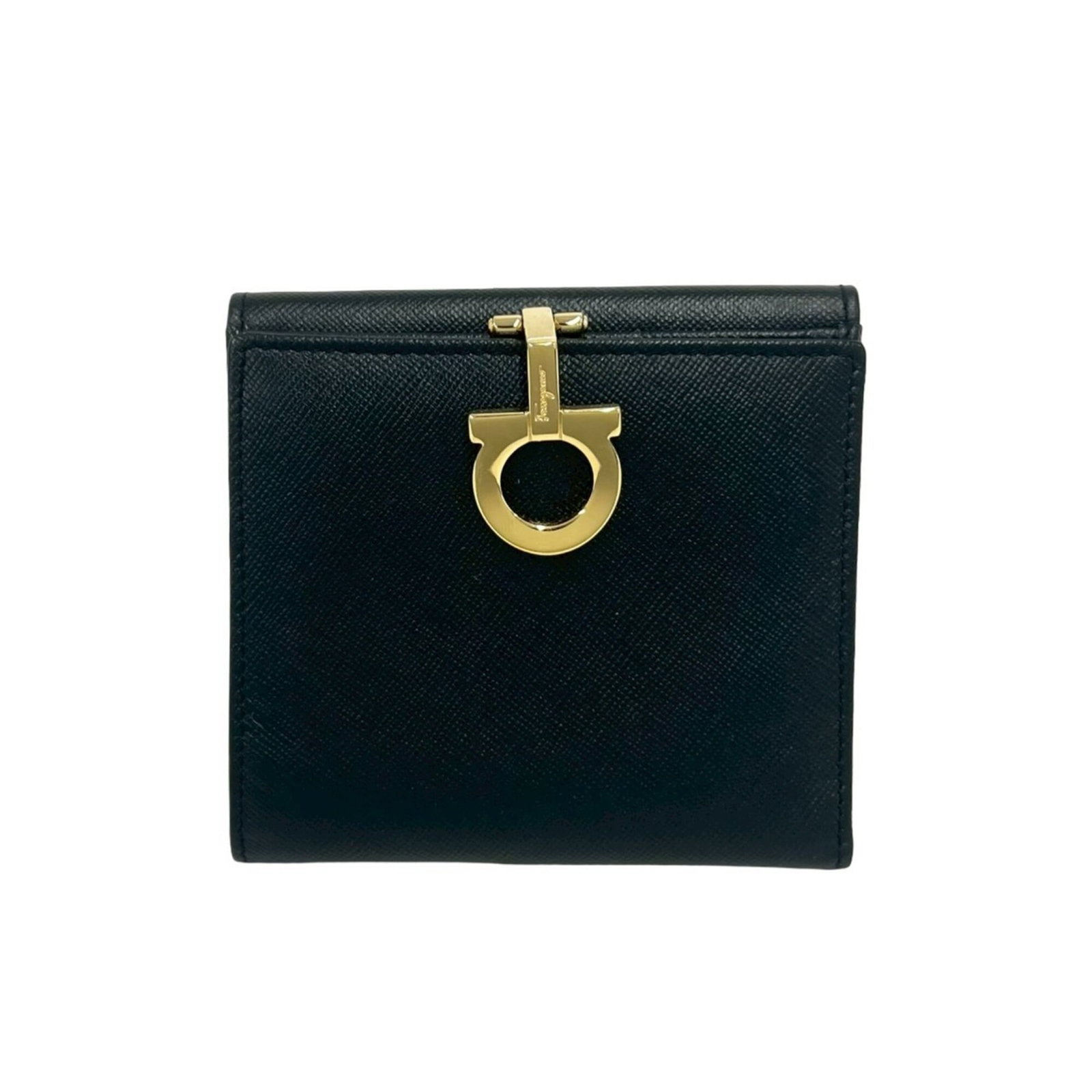 Salvatore Ferragamo Wallet (Bi-Fold) Leather: Salvatore Ferragamo Wallet (Bi-Fold) Leather The Salvatore Ferragamo bi-fold leather wallet boasts sleek black design, measuring 10cm x 10.5cm x 1.5cm in size. Made from high-quality leather, its clas