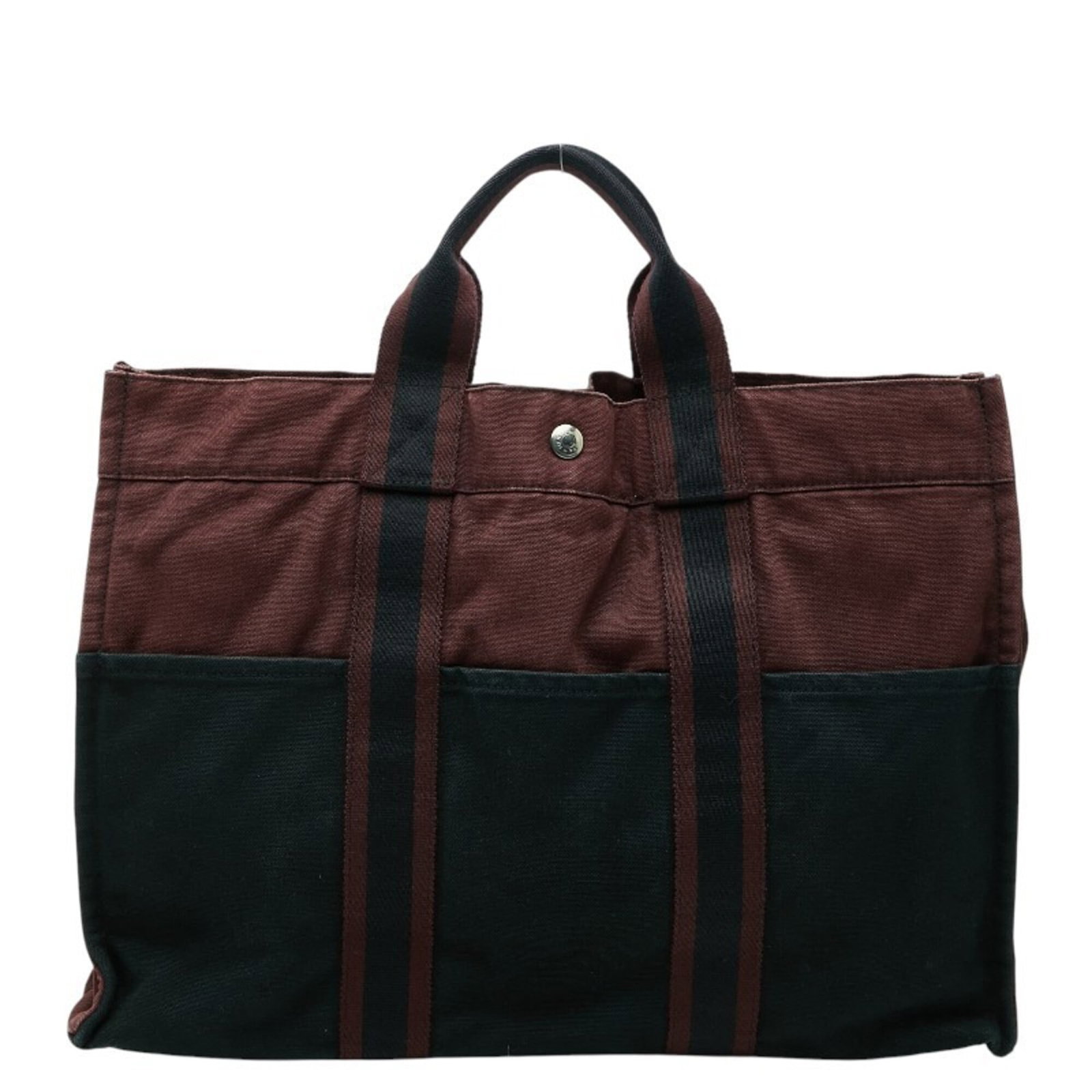 Handbag Tote Bag of Canvas by Hermes: Handbag Tote Bag of Canvas by Hermes Canvas by Hermes handbag tote bag in black, measuring 31cm x 42cm x 10cm. This canvas tote features a classic design with clean lines and a timeless aesthetic. Mad