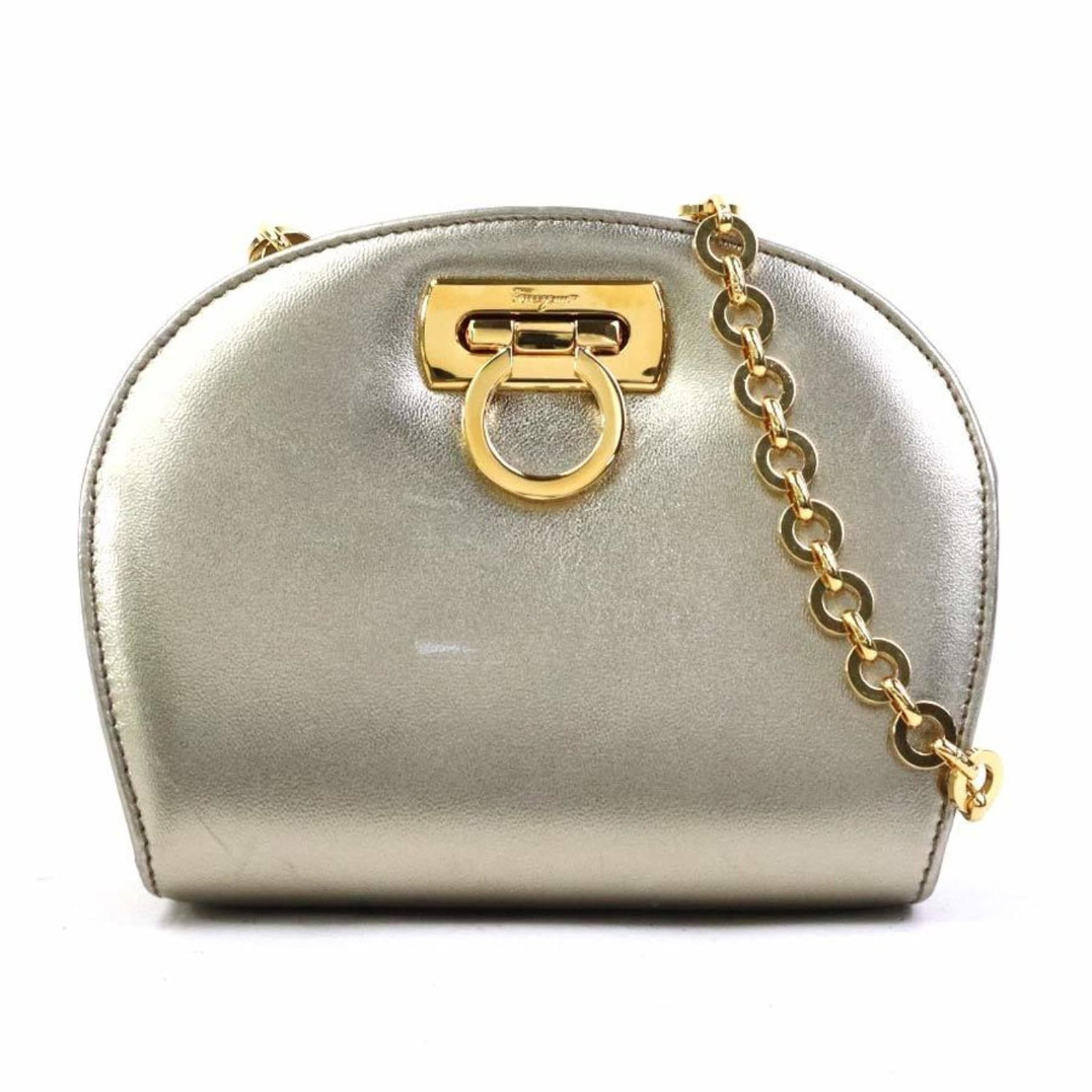 Shoulder Bag Leather Metal Salvatore Ferragamo: Shoulder Bag Leather Metal Salvatore Ferragamo This Italian shoulder bag from Salvatore Ferragamo features luxurious leather and striking gold metal accents, making it a stylish accessory for