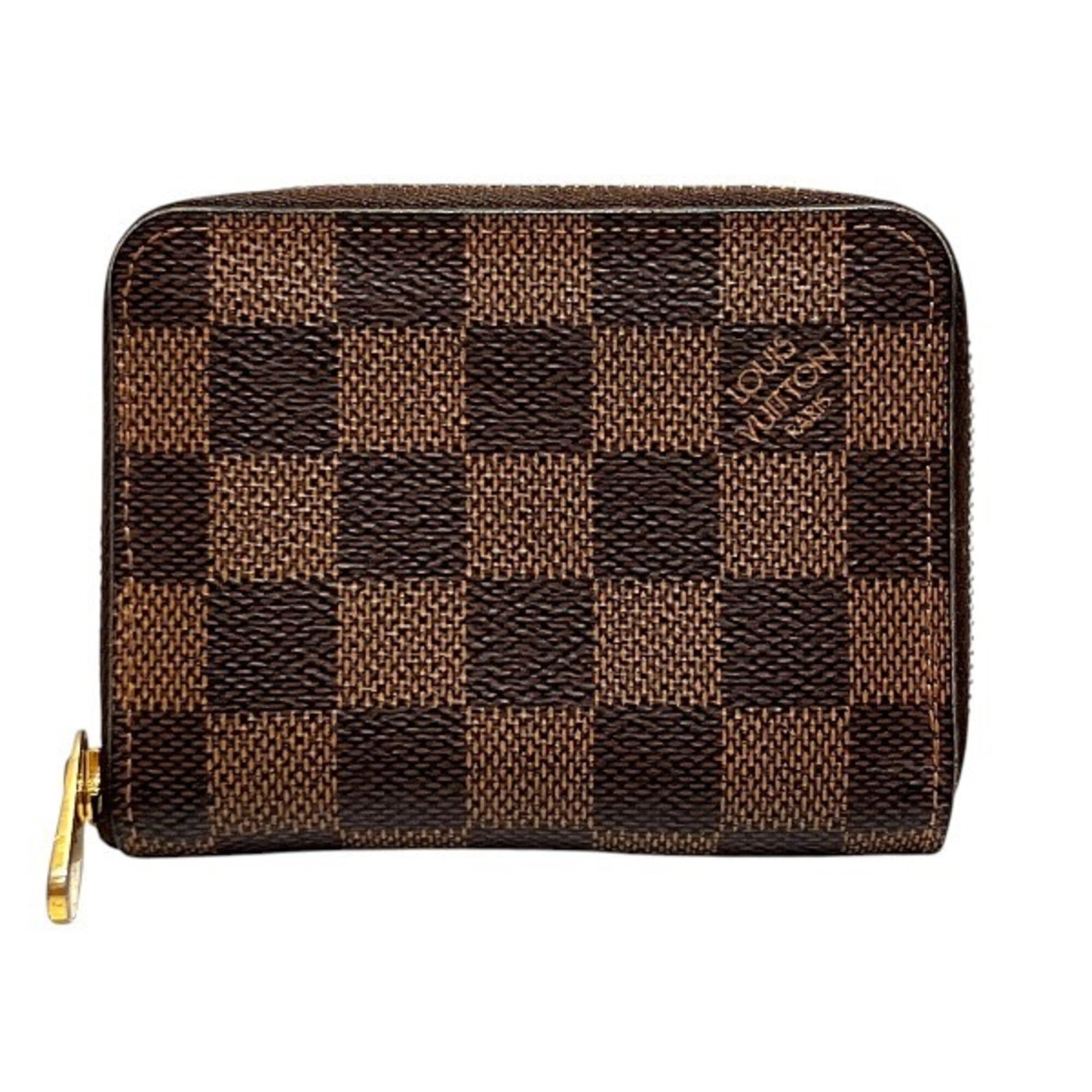 Coin purse from Louis Vuitton: Coin purse from Louis Vuitton The Louis Vuitton coin purse boasts classic brown hues and sleek dimensions, measuring 11cm x 8cm x 2cm. Its compact size makes it a convenient accessory for daily use.