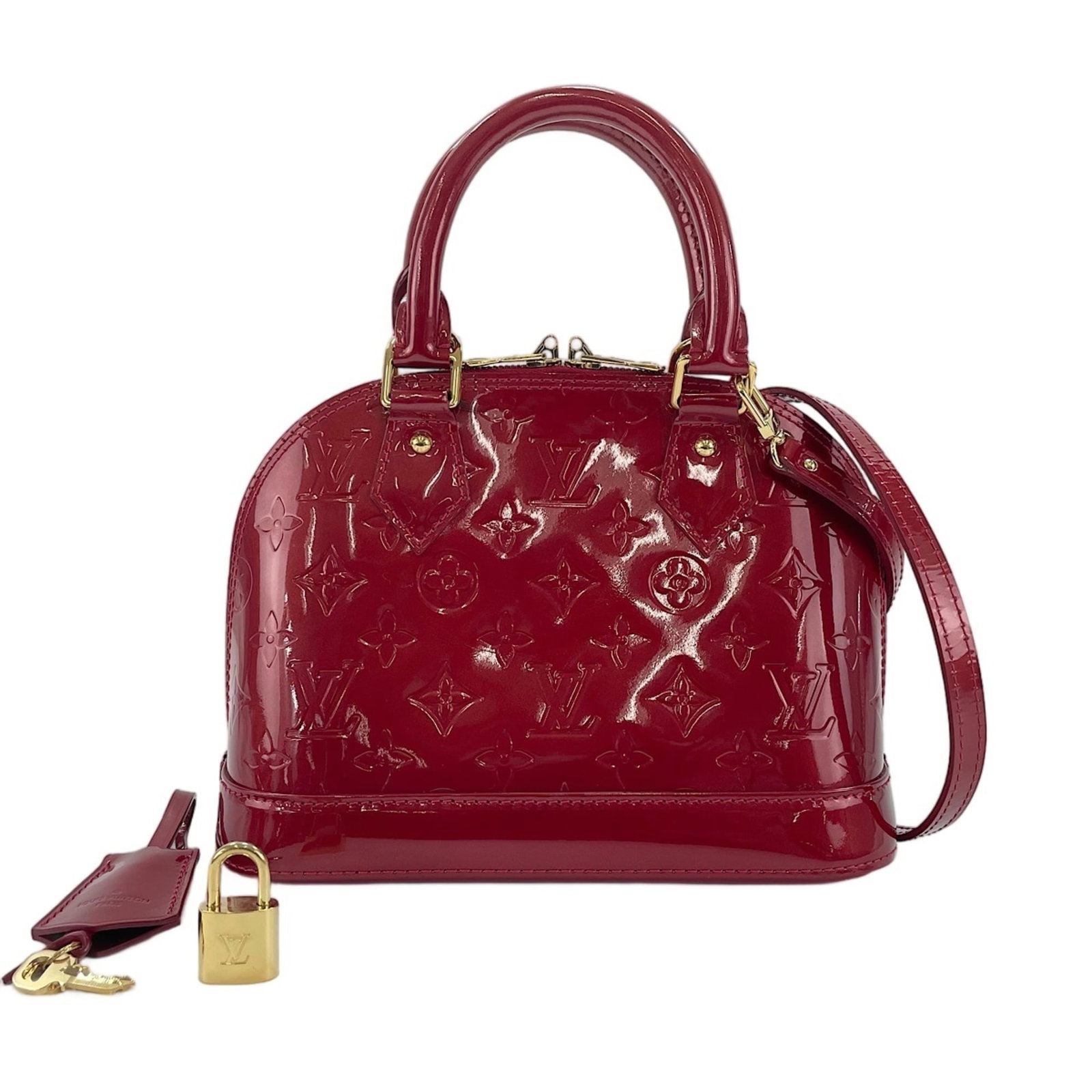 Louis Vuitton Handbag: Louis Vuitton Handbag Red Louis Vuitton Handbag, 18cm x 24cm x 12cm. This handbag features the iconic red color and classic design that has become synonymous with luxury travel. Made in France, it