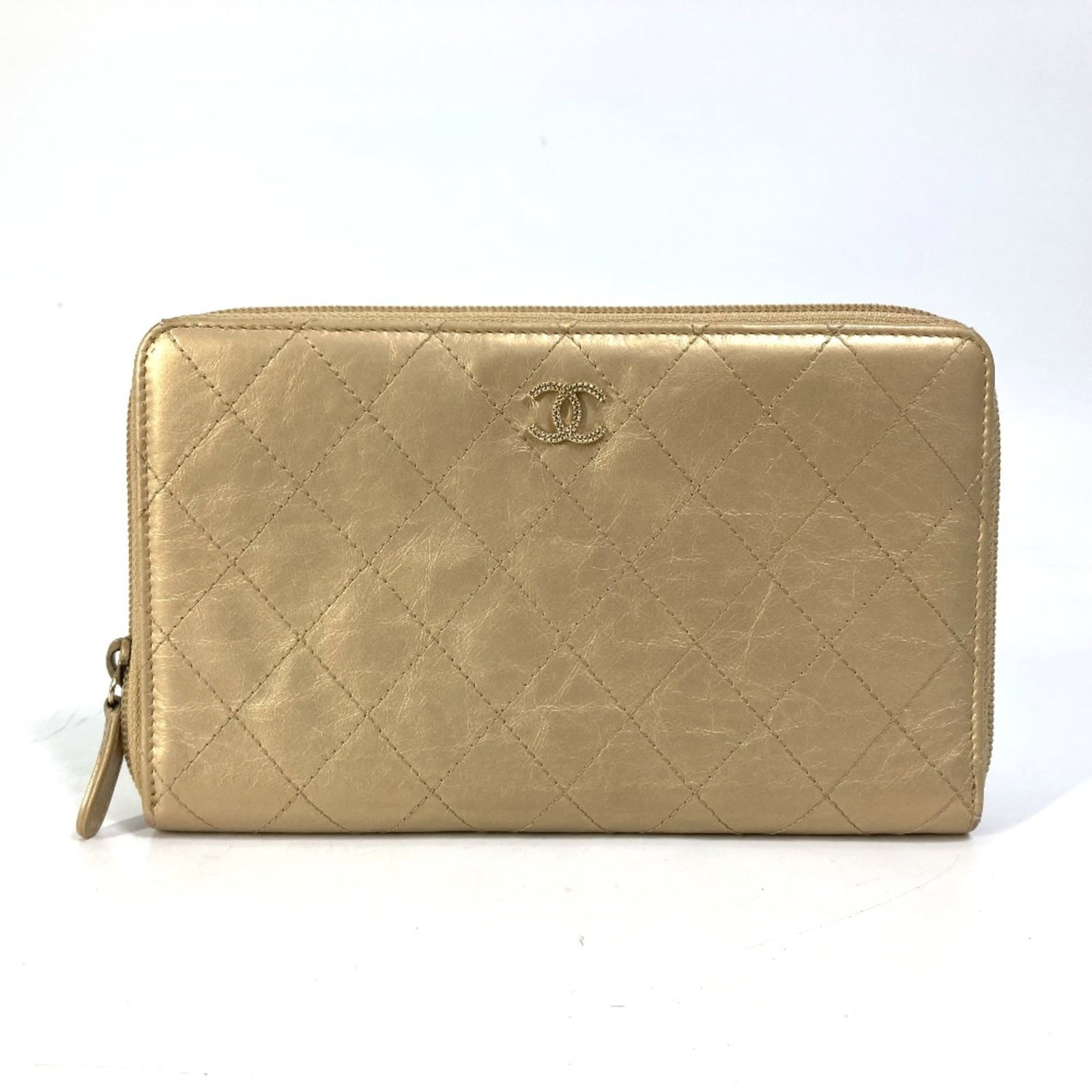 Chanel Long Wallet (Bi-Fold) Leather: Chanel Long Wallet (Bi-Fold) Leather Chanel's iconic bi-fold design, crafted from rich gold leather, offers a timeless and sophisticated accessory for everyday use. Measuring 19.5cm x 11.5cm in width