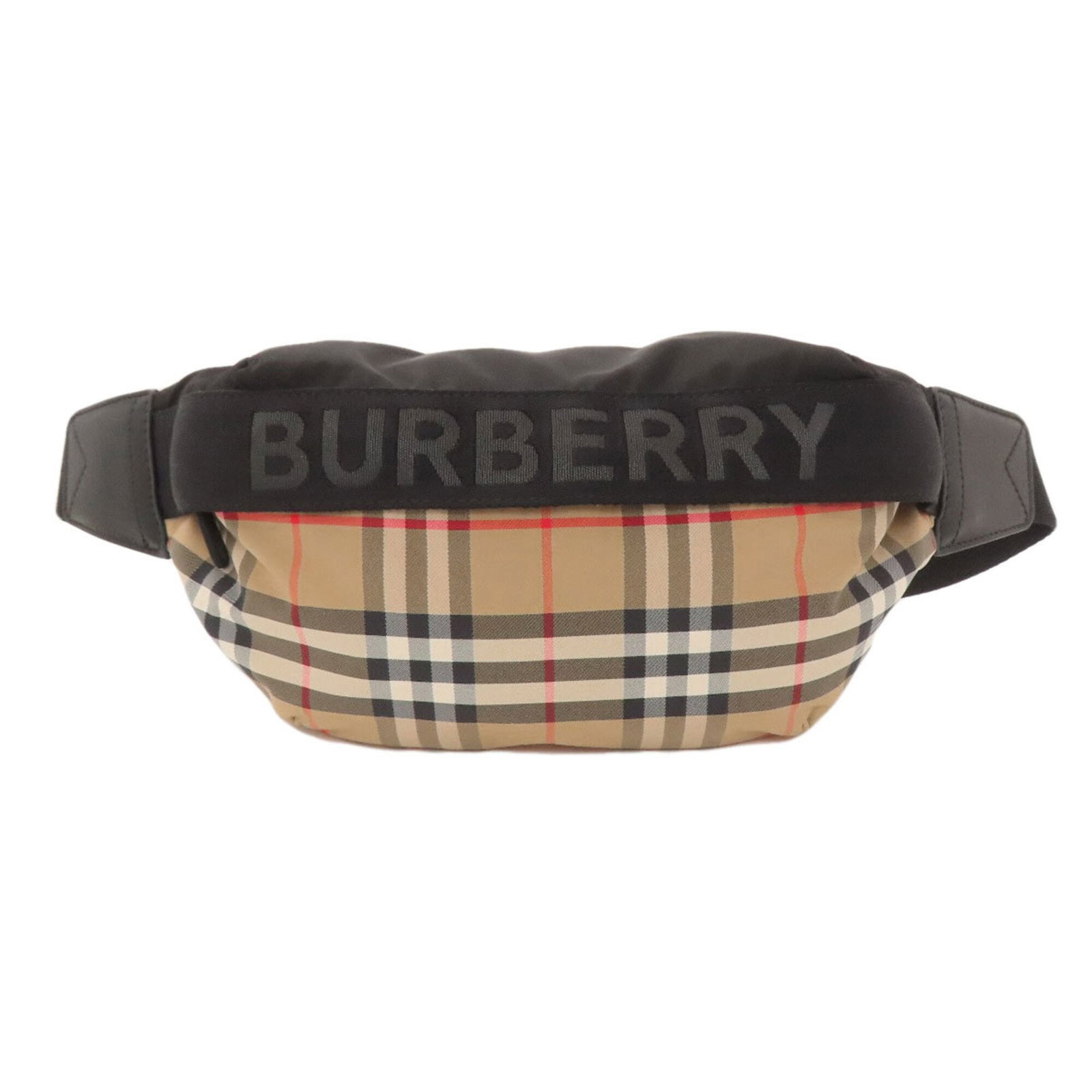 Nylon Canvas Sling Bag Burberry: Nylon Canvas Sling Bag Burberry Nylon canvas sling bag from Burberry, featuring a classic beige color and compact size. Made with durable nylon canvas material, this bag offers a stylish and