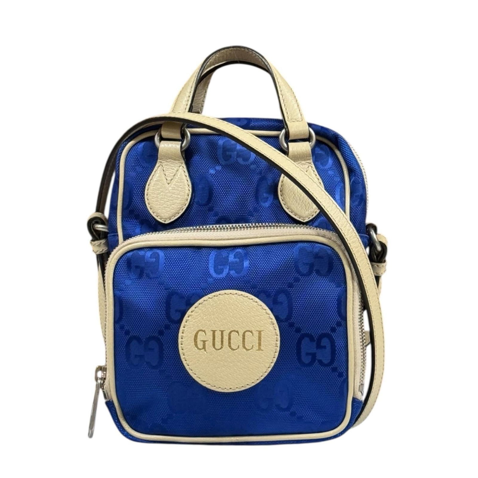 Nylon Leather Gucci Bag Shoulder: Nylon Leather Gucci Bag Shoulder Nylon and leather combine in this Gucci shoulder bag, available in beige and blue hues. The bag's dimensions are 20cm x 17cm x 8cm, making it a compact accessory. A
