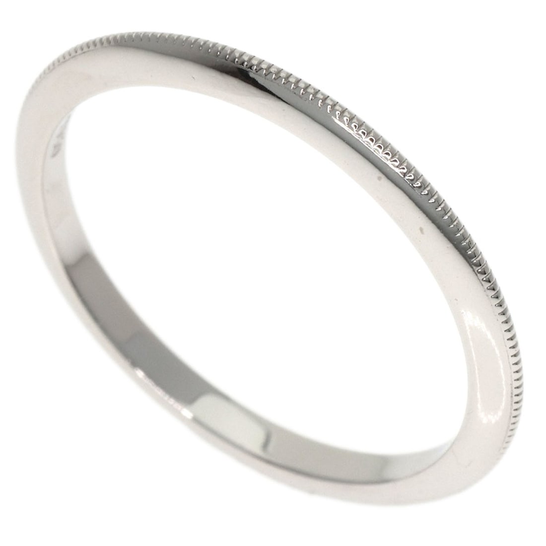 Knife Edge Ring Platinum Pt950 by Tiffany Co: Knife Edge Ring Platinum Pt950 by Tiffany Co PT950 platinum provides a strong, silver-white hue to the Knife Edge Ring by Tiffany Co. This style features a sleek design with no main stone, making it a