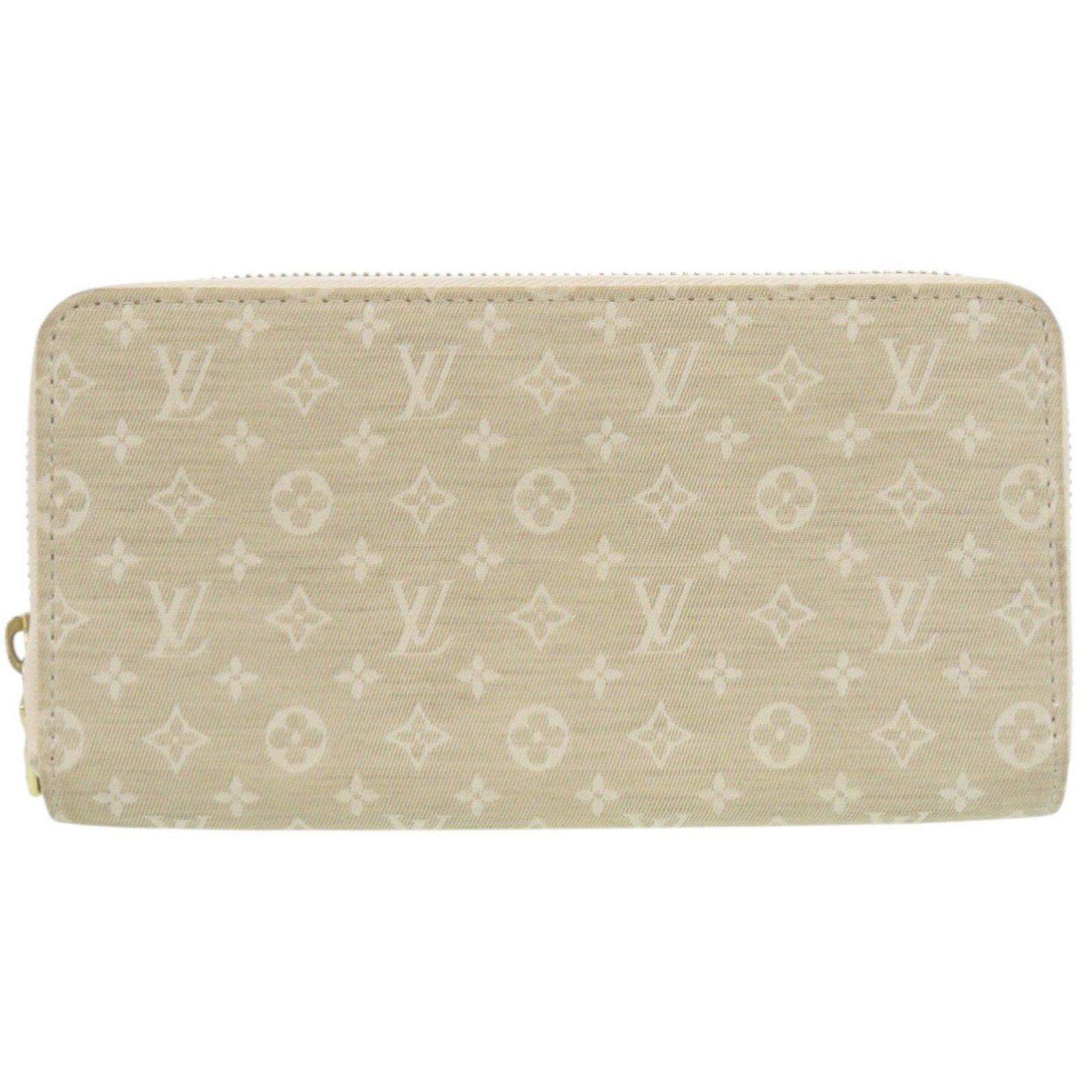 Louis Vuitton Long Bi Fold Monogram Mini: Louis Vuitton Long Bi Fold Monogram Mini The Louis Vuitton Long Bi Fold Monogram Mini offers a compact and stylish wallet solution, featuring the iconic monogram pattern in beige. With its sleek desig