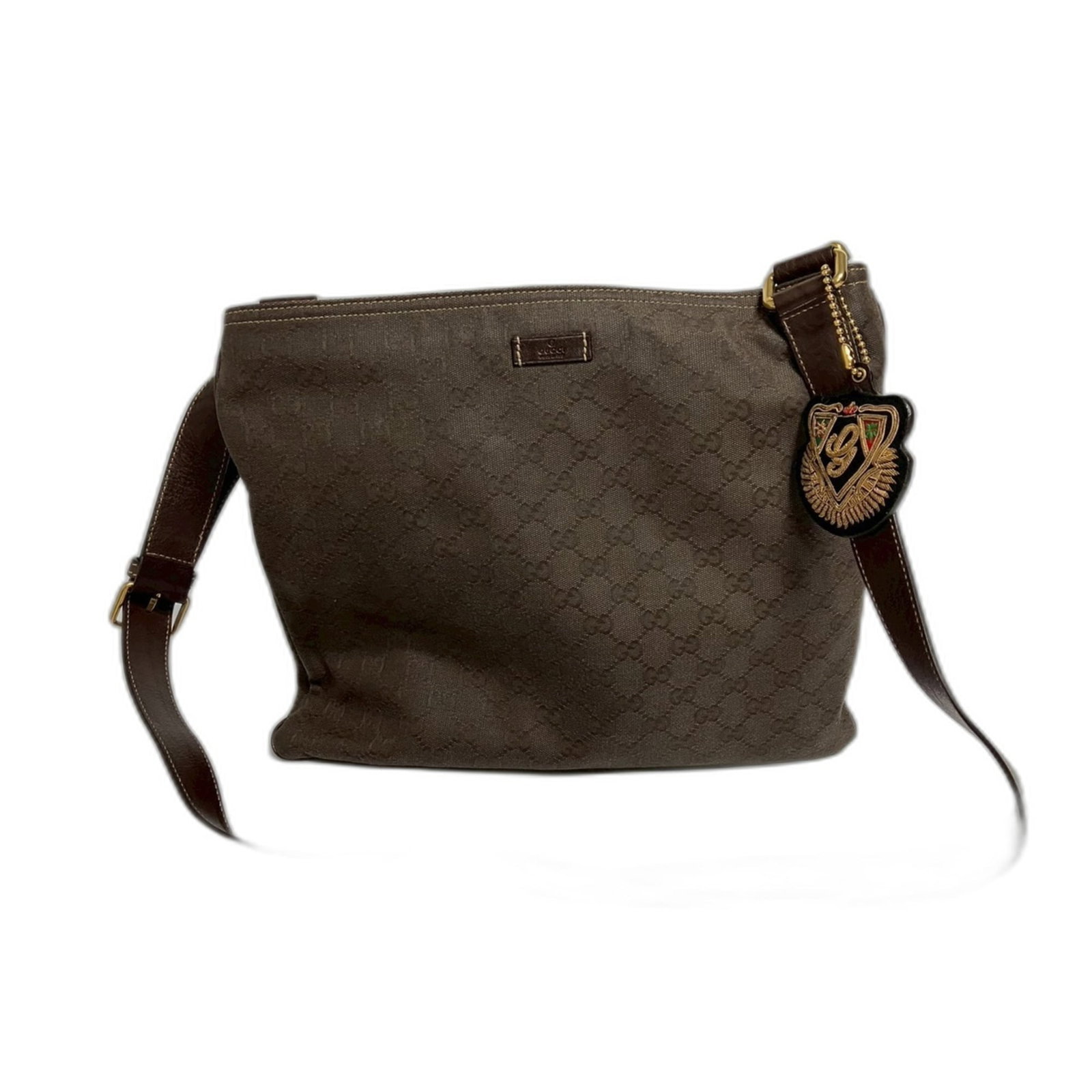 Shoulder Bag Gucci: Shoulder Bag Gucci The Gucci shoulder bag boasts a rich, brown hue and sleek design. With dimensions of 29cm x 34cm, it offers ample space for everyday essentials. Its classic style makes it a versati