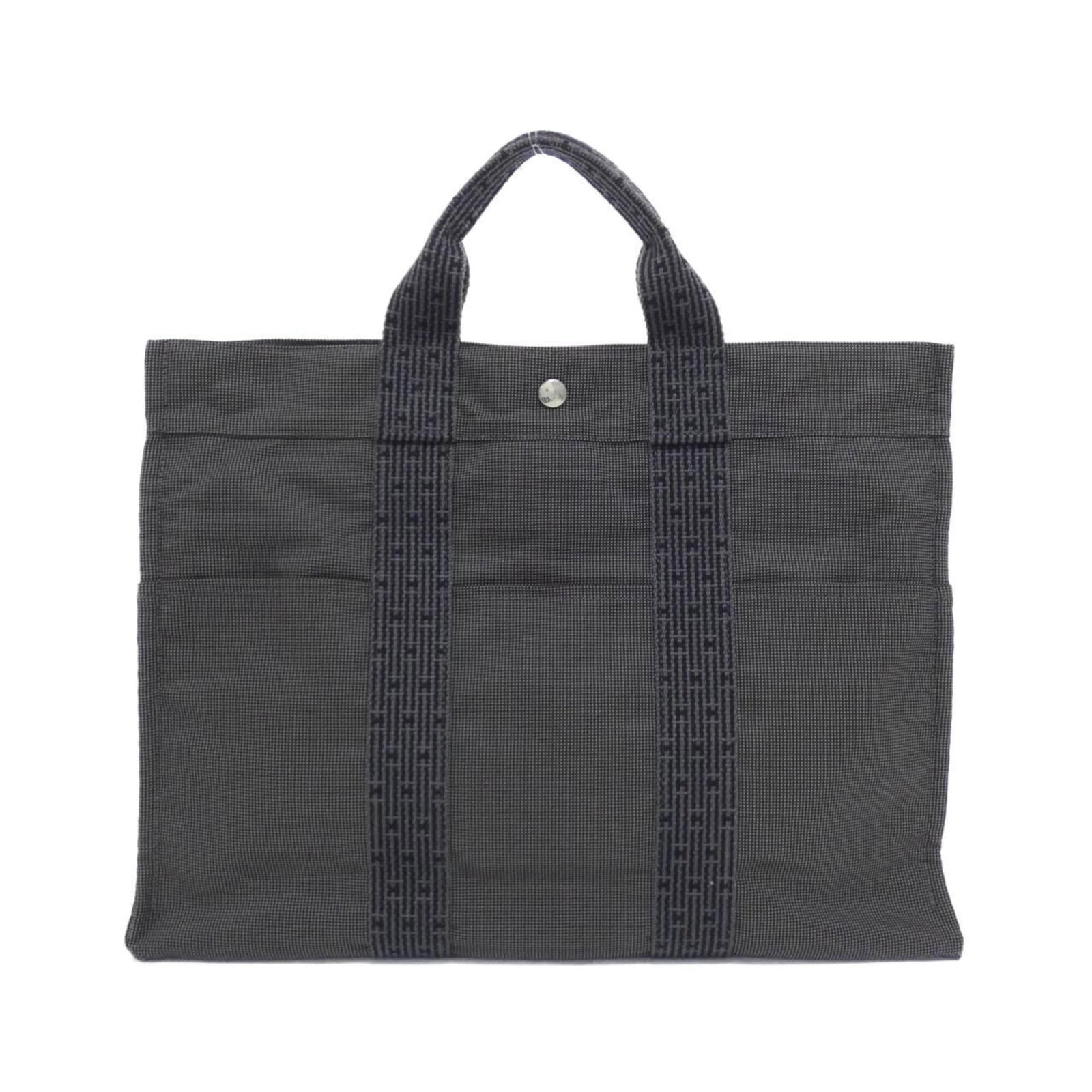 Handbag Canvas by Hermes: Handbag Canvas by Hermes Canvas by Hermes, a sleek and sophisticated black handbag with silver hardware, measures 33cm x 43cm x 11cm. Its canvas material provides a sturdy yet lightweight feel, making