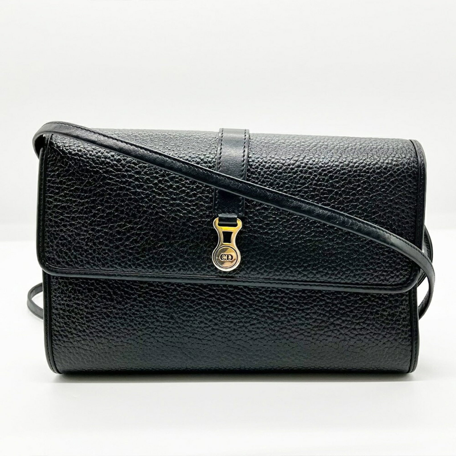 Shoulder bag leather by Christian Dior: Shoulder bag leather by Christian Dior Black leather shoulder bag by Christian Dior, featuring a sleek design with a magnet closure and a spacious pouch for added convenience. The bag measures 15cm x