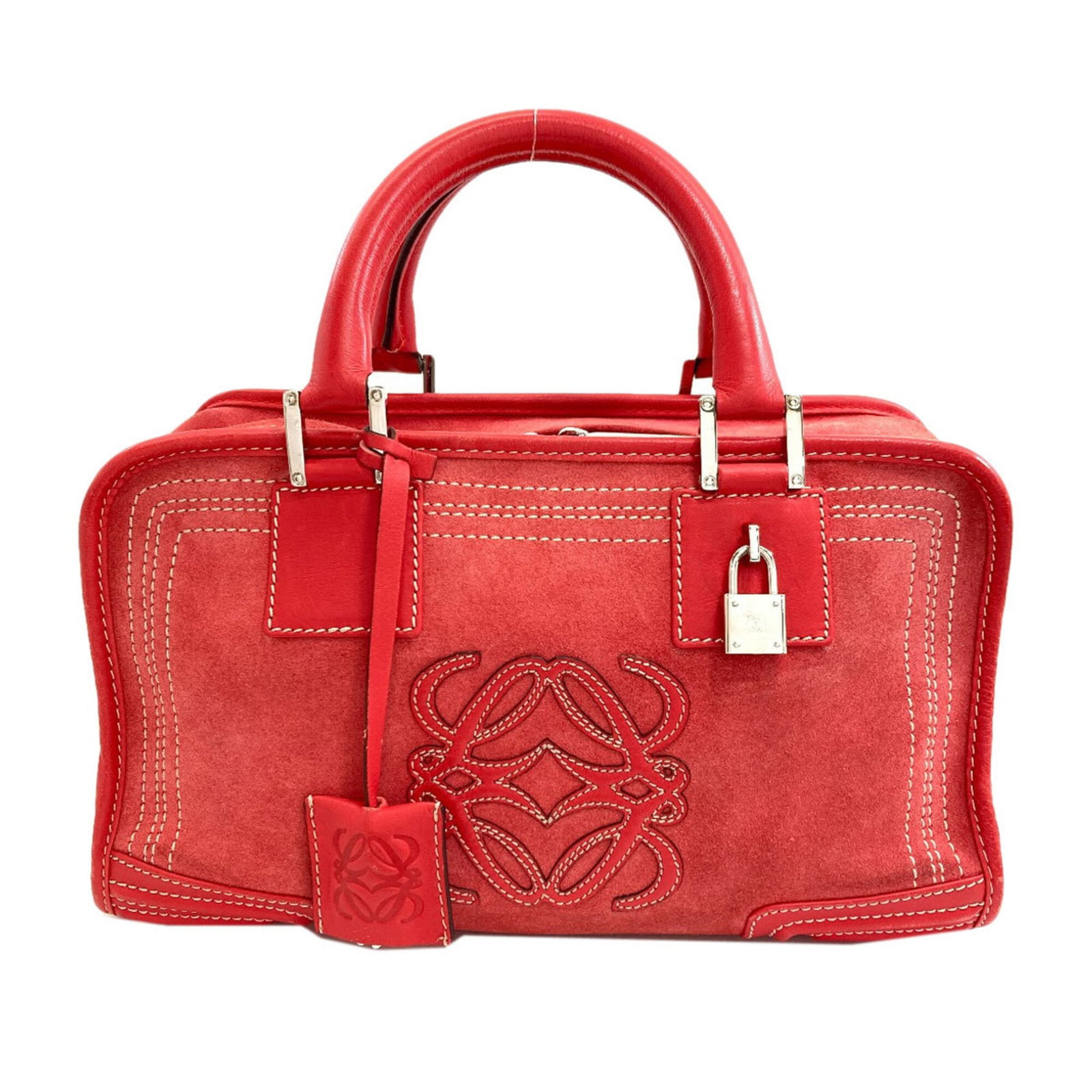 Handbag suede by Loewe: Handbag suede by Loewe Suede by Loewe, a vibrant red handbag with clean lines and classic design. Measuring 17cm x 29cm x 13cm, it offers a stylish and compact size for everyday use. Made from