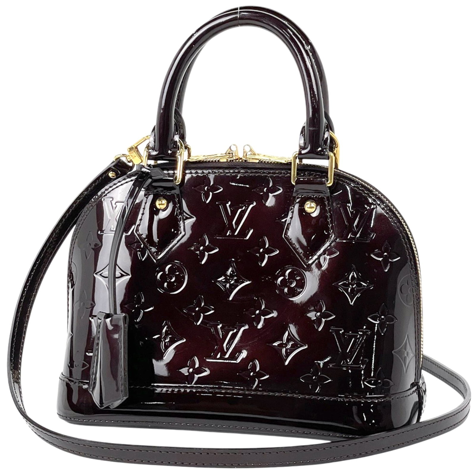 Louis Vuitton Handbag Monogram Vernis: Louis Vuitton Handbag Monogram Vernis Monogram Vernis, the iconic Louis Vuitton design, takes center stage in this stunning Amarante purple handbag. Measuring 17cm x 23.5cm x 11cm, its sleek shape and