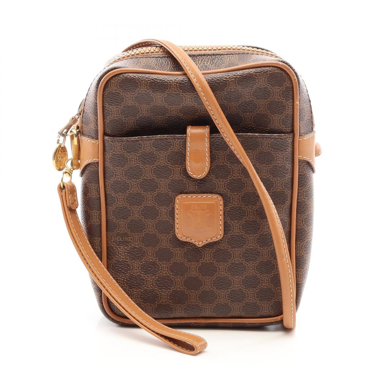 Coated canvas leather handbag shoulder bag by Celine: Coated canvas leather handbag shoulder bag by Celine The Celine coated canvas leather handbag shoulder bag boasts a rich brown color and sleek design, making it a stylish accessory for everyday use. M