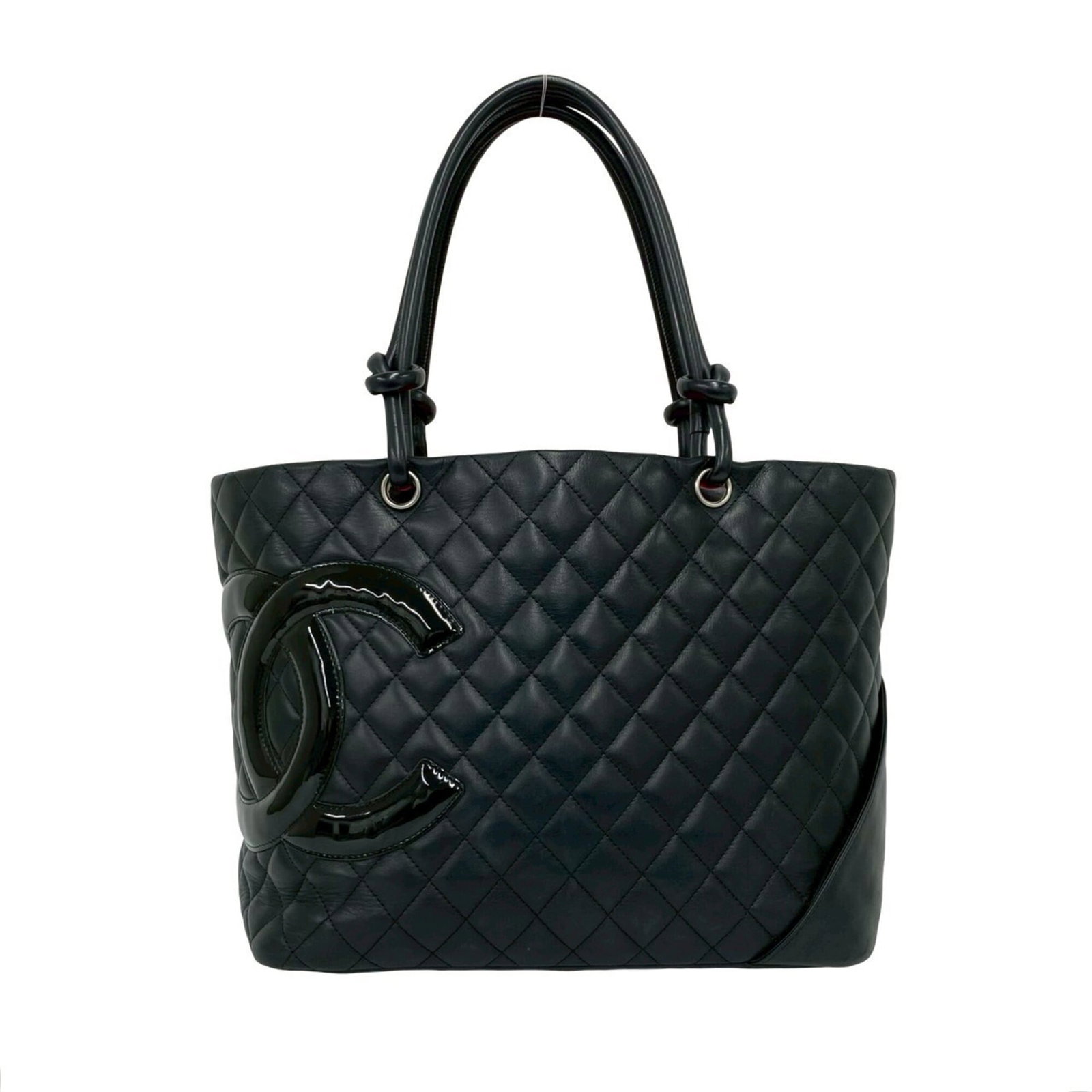 Handbag tote leather bag Chanel: Handbag tote leather bag Chanel The Chanel leather tote bag boasts sleek black leather, measuring 25cm x 29cm x 14.5cm in size, making it a stylish and practical accessory for daily use. Its classic