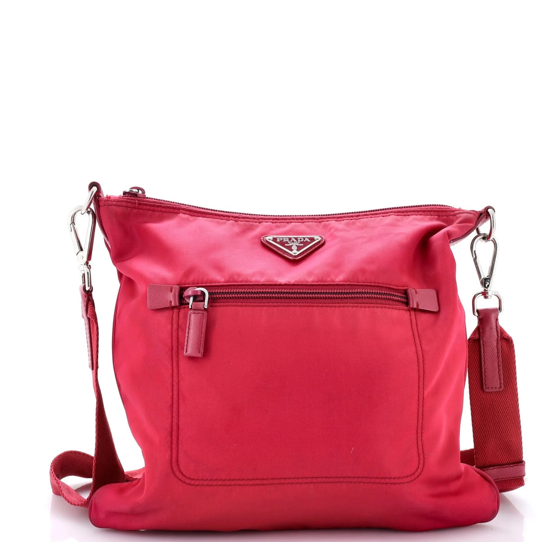 Tessuto medium pocket messenger bag by Prada: Tessuto medium pocket messenger bag by Prada The Prada Tessuto medium pocket messenger bag boasts a striking pink exterior made from durable nylon, featuring a classic cross-body design with a front p
