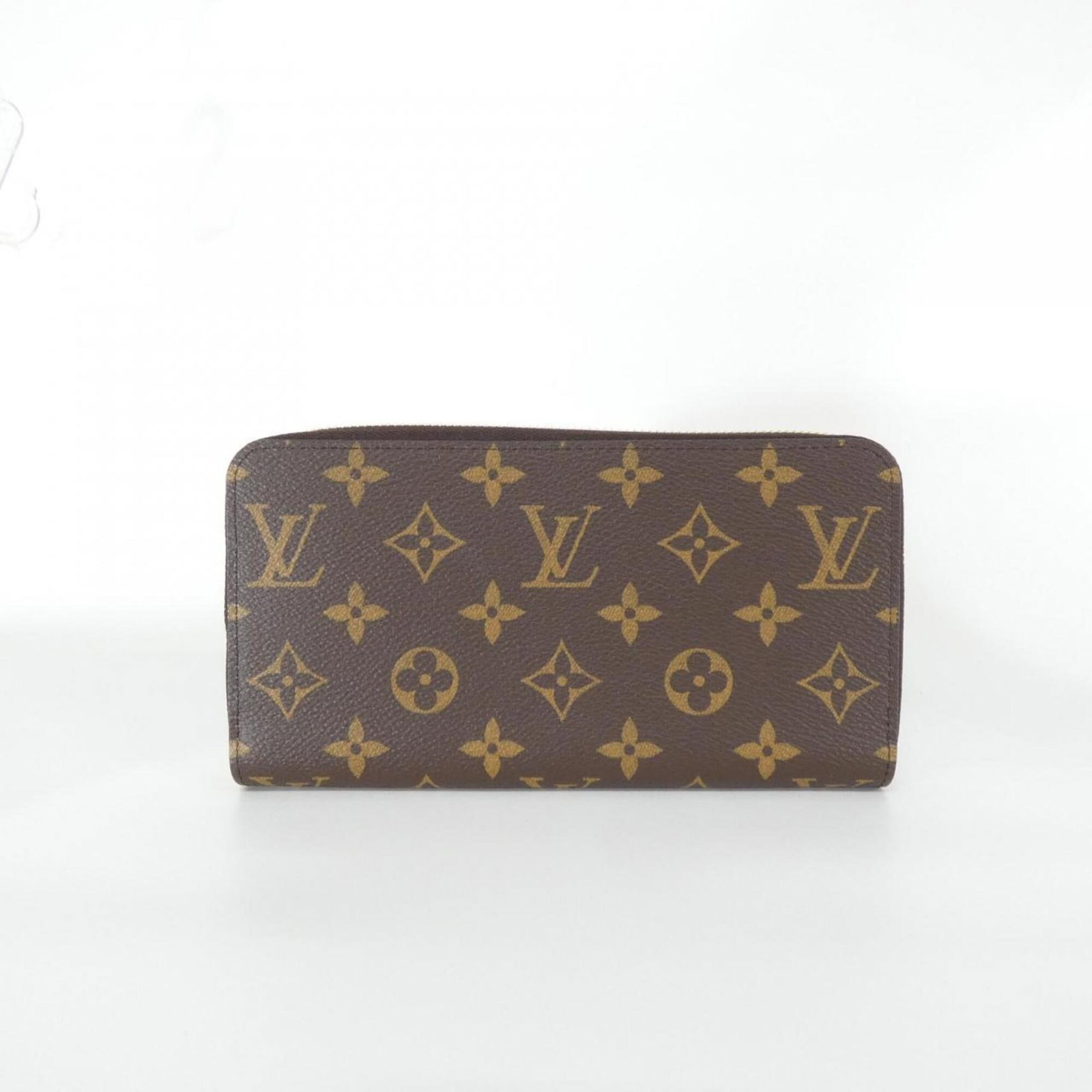 Canvas wallet bi-fold coated long Louis Vuitton: Canvas wallet bi-fold coated long Louis Vuitton Coated canvas construction adds durability to the classic bi-fold design, while marron color provides a timeless and sophisticated look. This long