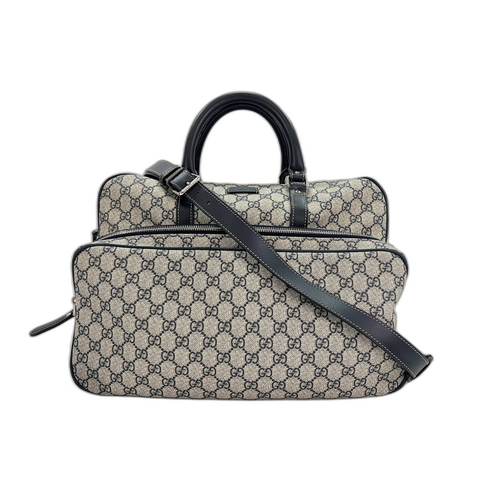 Handbag by Gucci: Handbag by Gucci Navy Gucci handbag with clean lines and classic design, featuring a sturdy build and adjustable strap length. The bag measures 27cm x 39cm x 14cm and has a handle drop of 12cm,