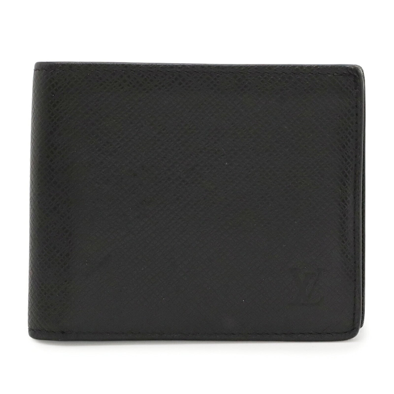 Louis Vuitton Wallet (Bi-Fold) Taiga Leather: Louis Vuitton Wallet (Bi-Fold) Taiga Leather Taiga leather wallet with bi-fold design, crafted by Louis Vuitton. This black Noir wallet features a classic style and durable construction, measuring 9.5