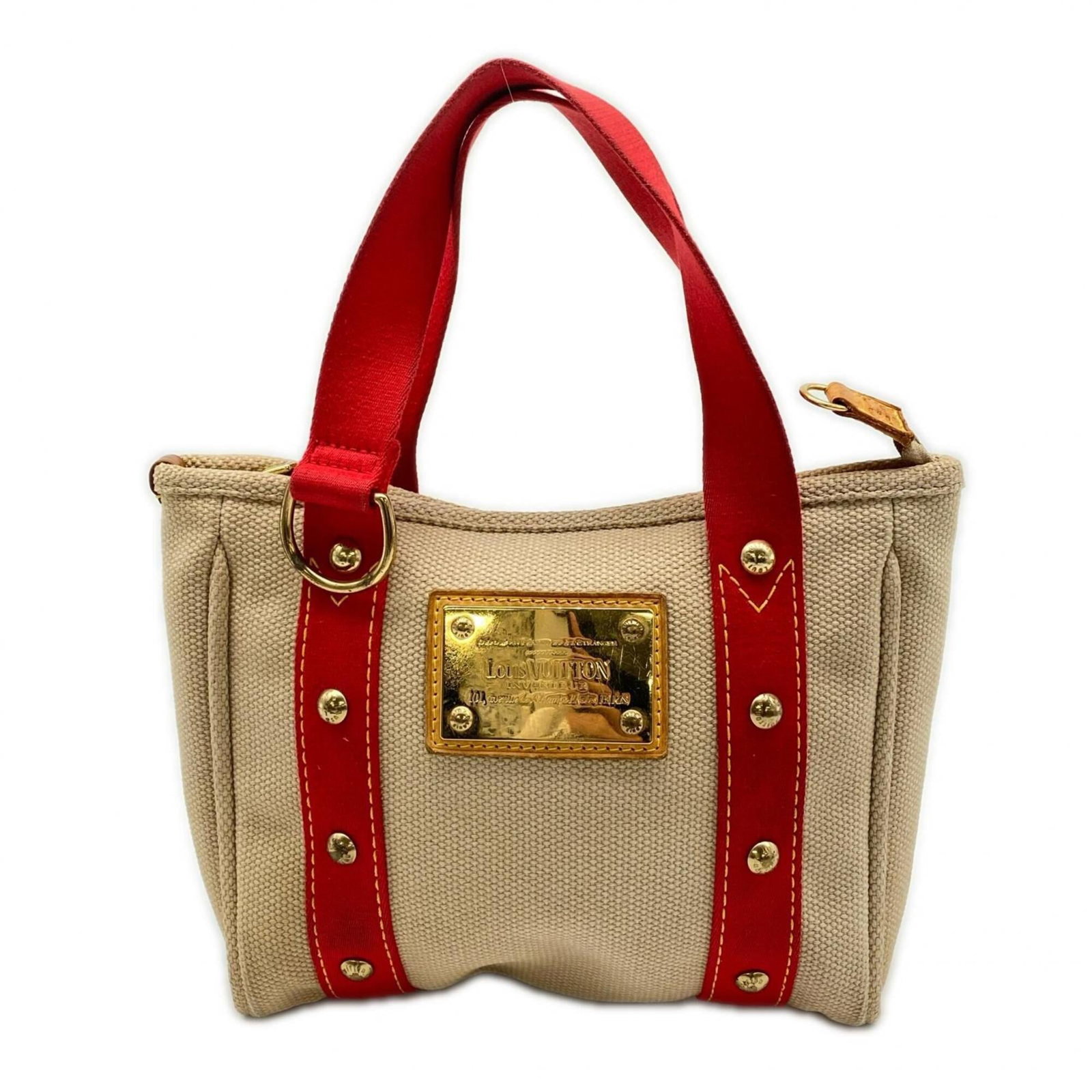 Handbag Canvas from Louis Vuitton: Handbag Canvas from Louis Vuitton Canvas from Louis Vuitton, a classic handbag design made from high-quality canvas. This iconic piece features a timeless beige and red color combination that exudes e