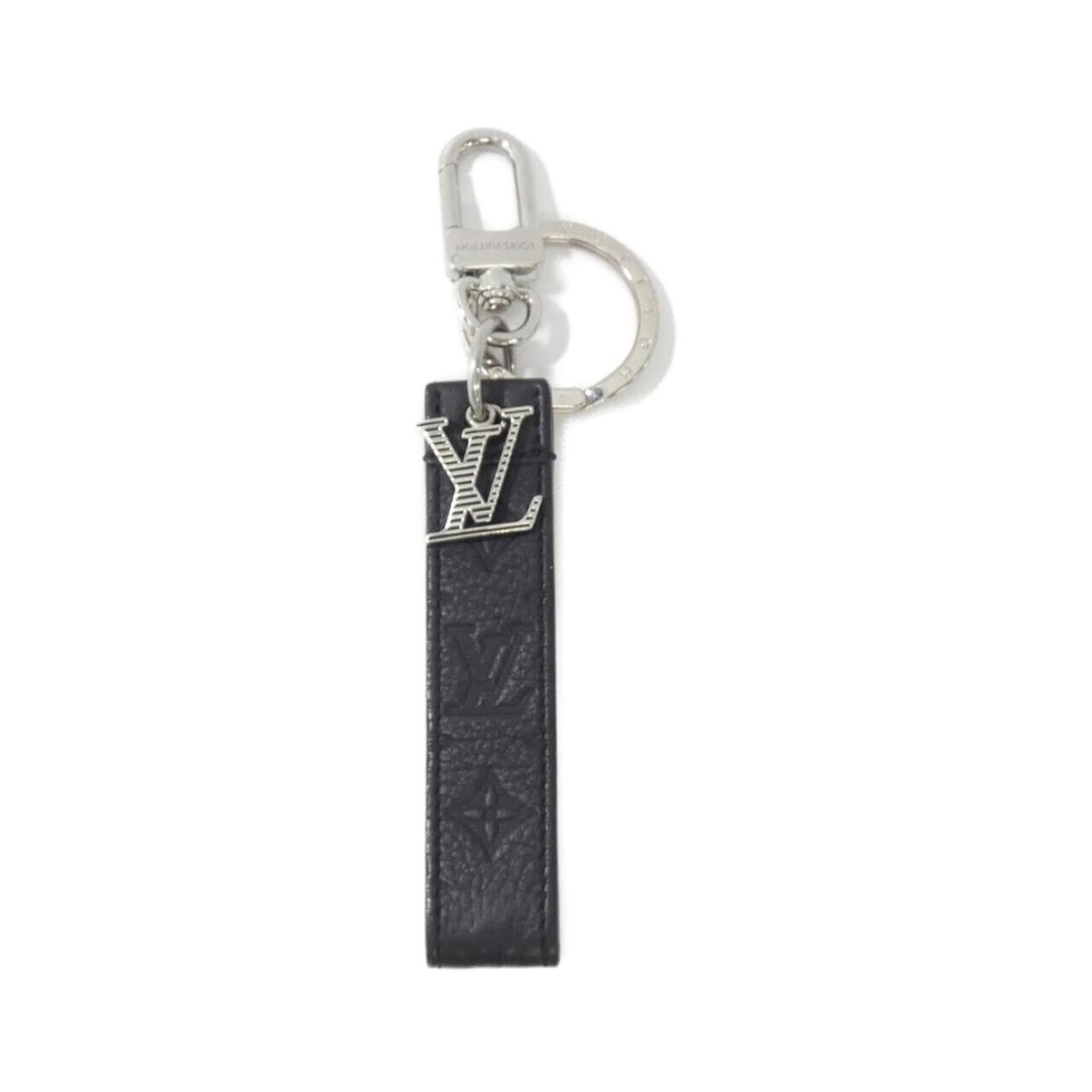 Keyring Leather Louis Vuitton: Keyring Leather Louis Vuitton Black leather keyring from Louis Vuitton, crafted from calf leather. The iconic brand's signature style is evident in every detail, making this a distinctive accessory fo