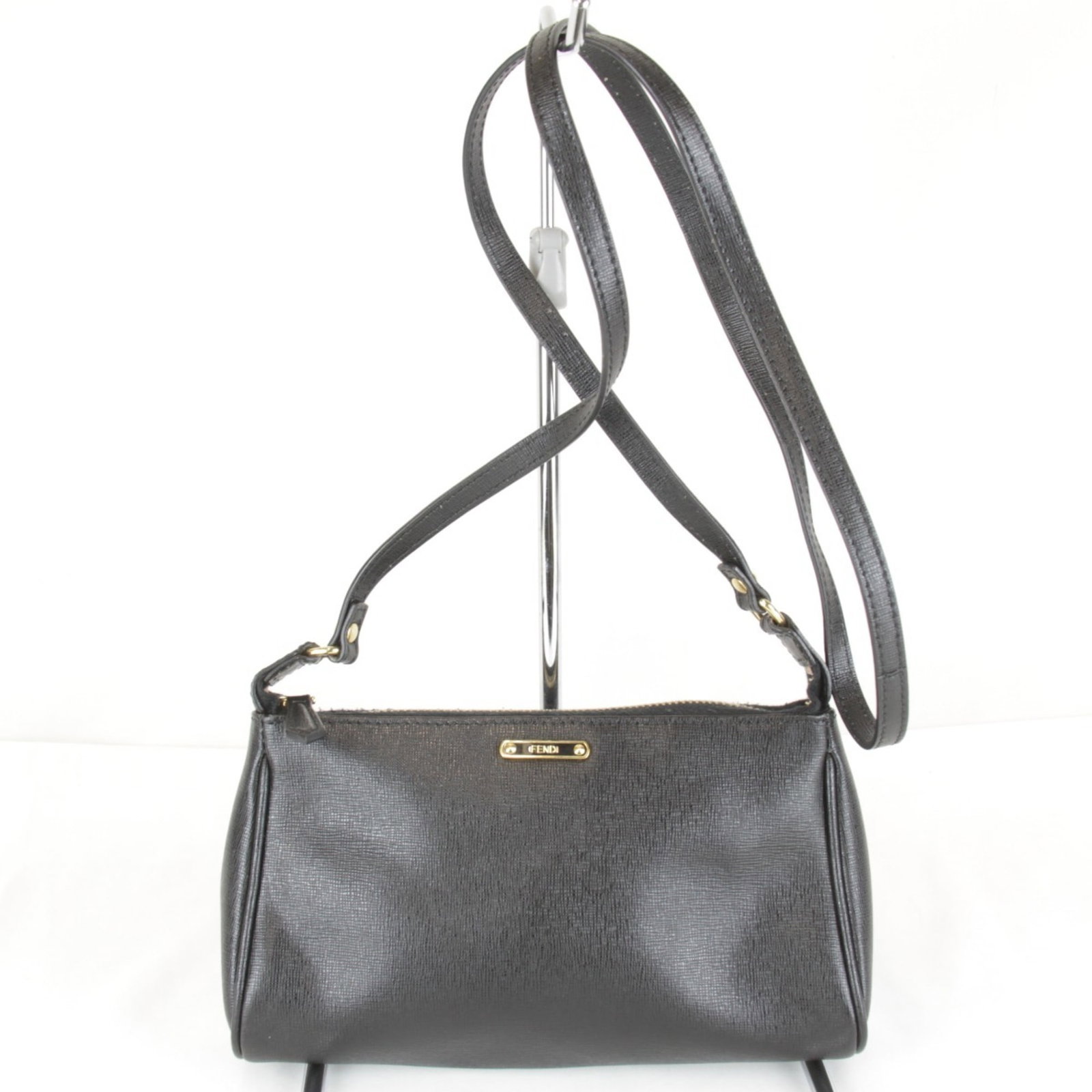 Shoulder Bag Leather Pouch By Fendi: Shoulder Bag Leather Pouch By Fendi Black leather shoulder bag with a sleek design, measuring 12cm x 21cm x 5cm. The Fendi brand is known for its high-quality materials and craftsmanship, evident in