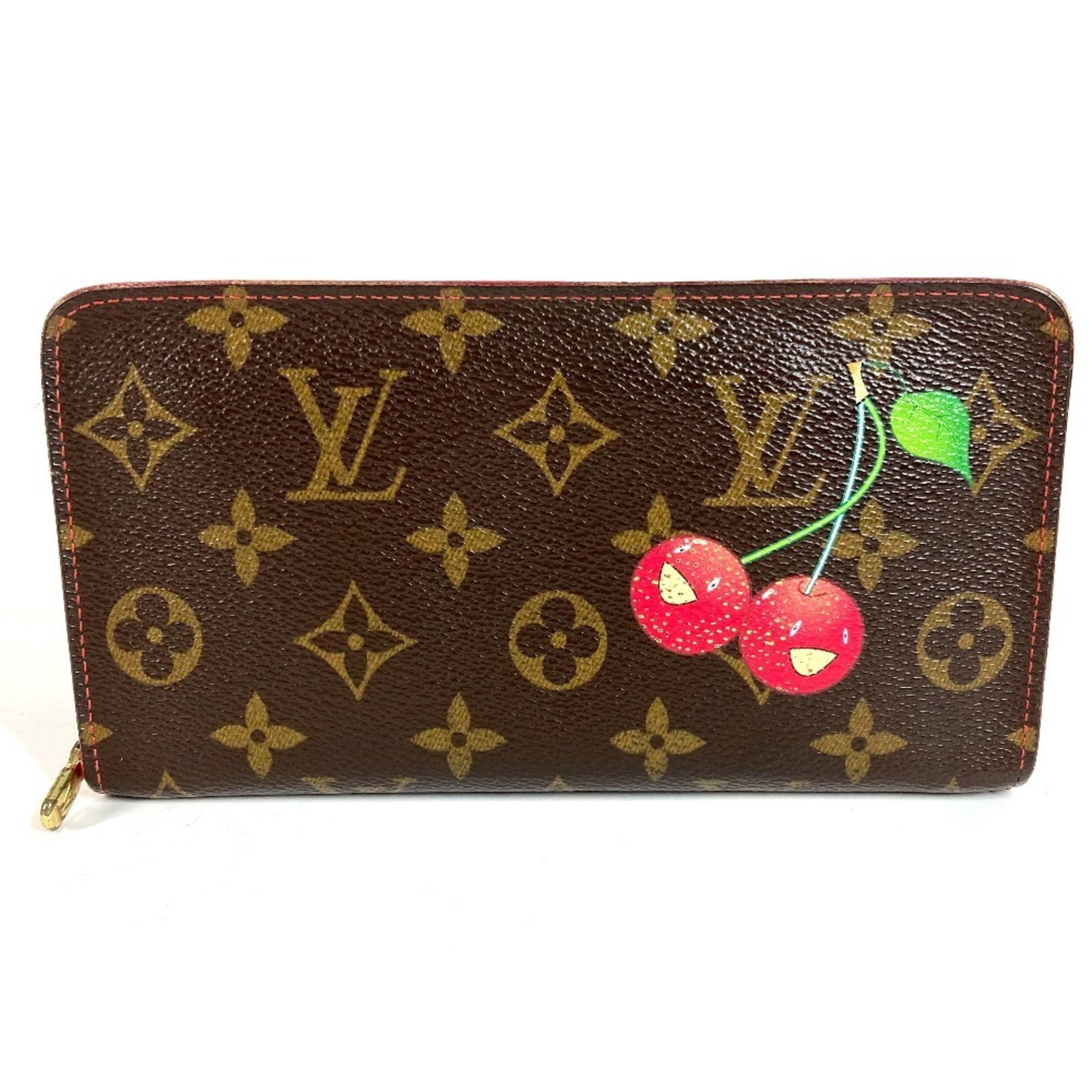 Louis Vuitton Cherry Blossom Bi Fold Monogram Long Wallet: Louis Vuitton Cherry Blossom Bi Fold Monogram Long Wallet Brown and Red Monogram Cherry Blossom design adorns the Louis Vuitton bi-fold long wallet, adding a touch of elegance to everyday carry. The