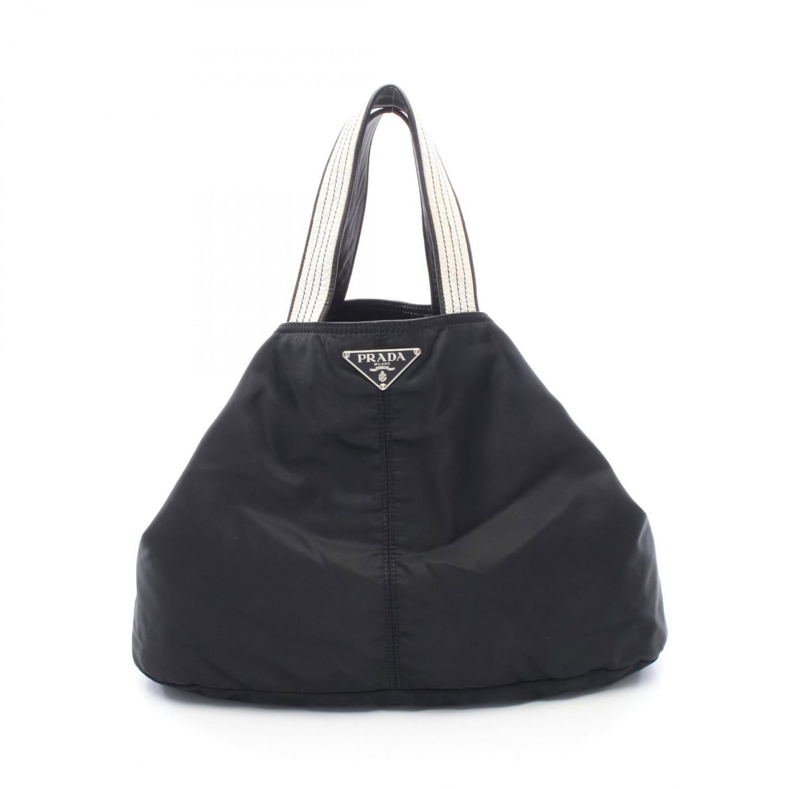 Nylon Leather Prada Handbag Tote: Nylon Leather Prada Handbag Tote Nylon and leather blend in sleek black, defining the Prada handbag tote's modern silhouette. The bag measures 29.5cm x 47cm x 20cm, making it a versatile size for dail