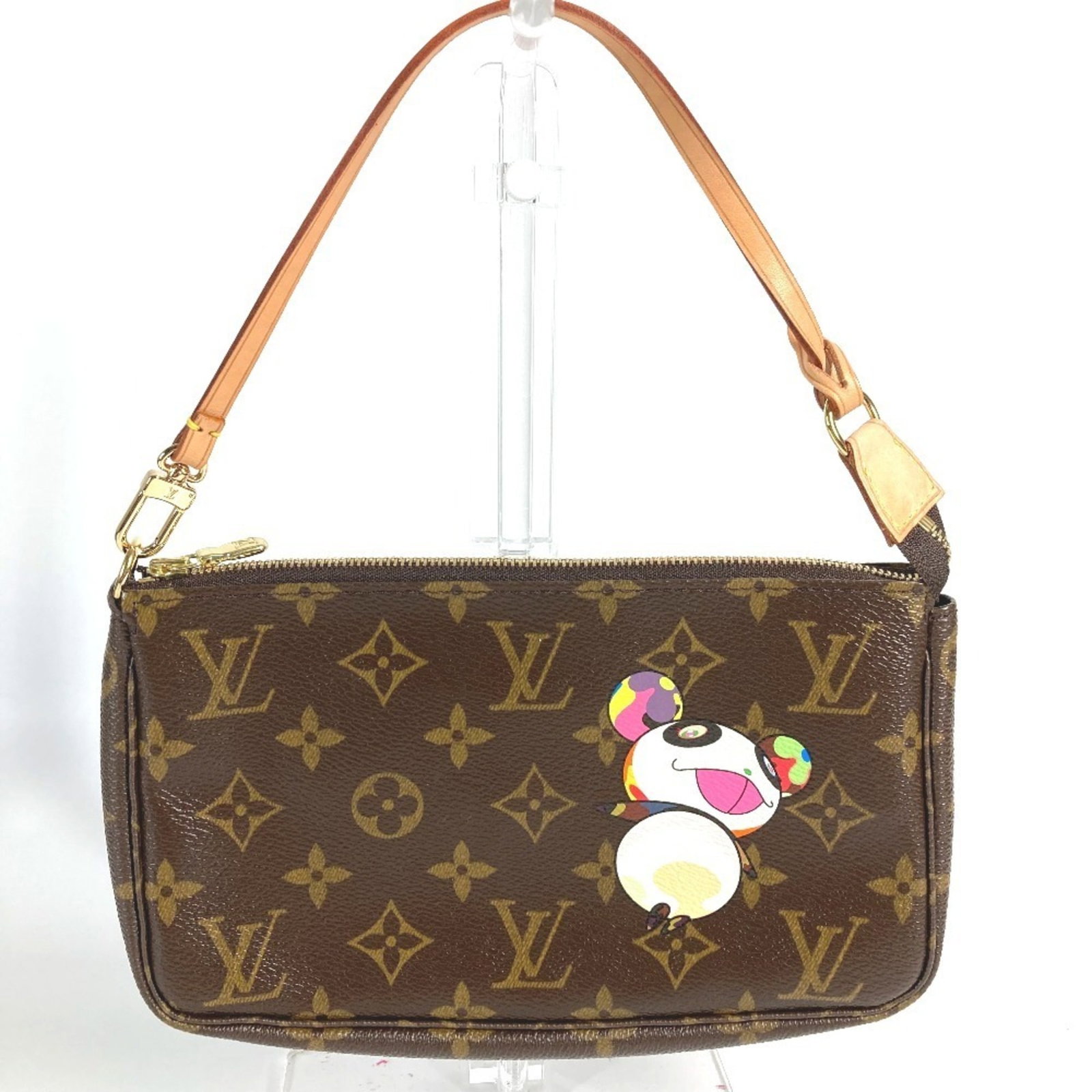Monogram shoulder bag pouch handbag Louis Vuitton: Monogram shoulder bag pouch handbag Louis Vuitton Monogram shoulder bag pouch handbag Louis Vuitton features the iconic Monogram design in brown, a classic and timeless choice. Made from high-quality