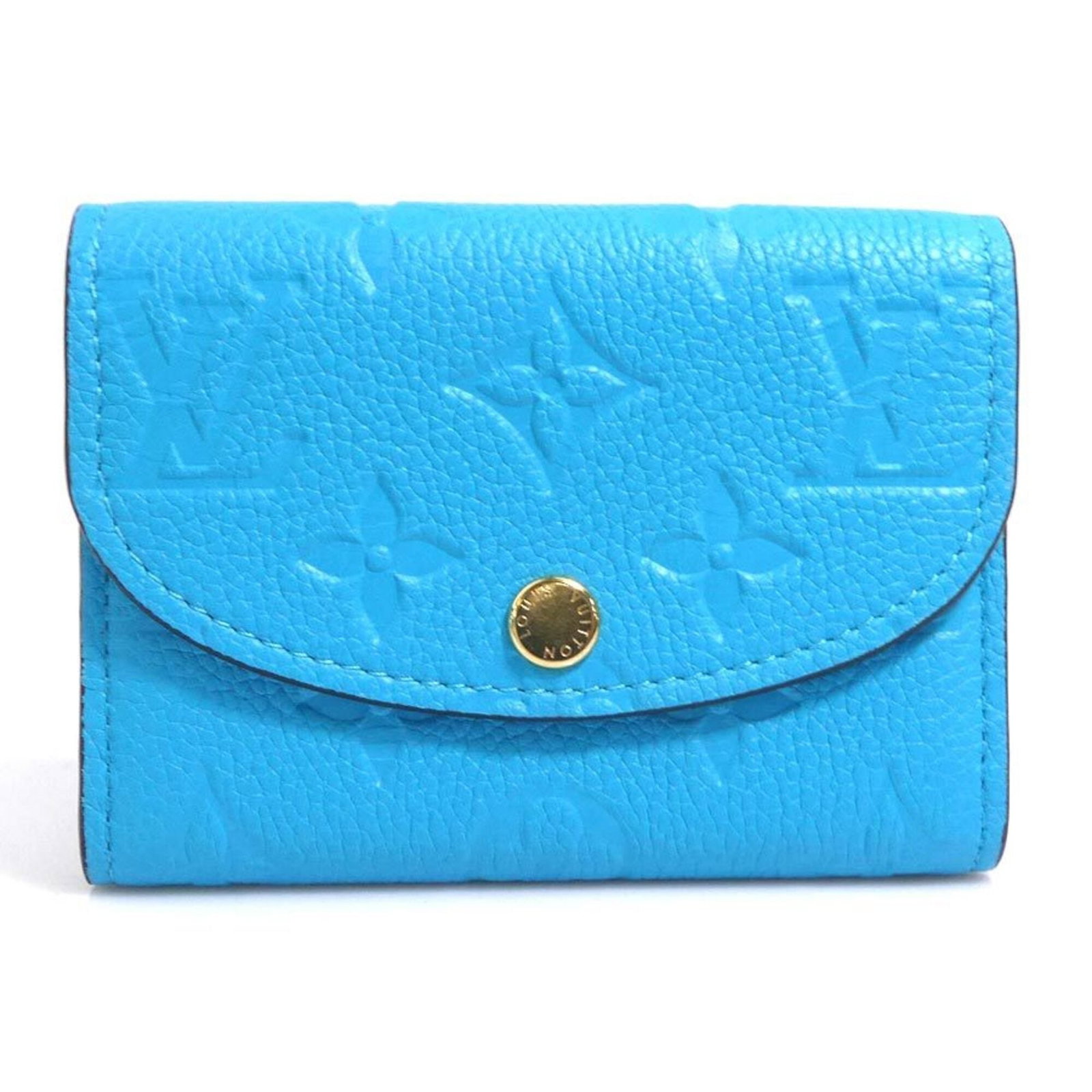 Louis Vuitton Coin Purse/ Coin Case Monogram Empreinte: Louis Vuitton Coin Purse/ Coin Case Monogram Empreinte Monogram Empreinte coin purse/coin case from Louis Vuitton, featuring the iconic turquoise color and signature monogram pattern. Made in Spain,