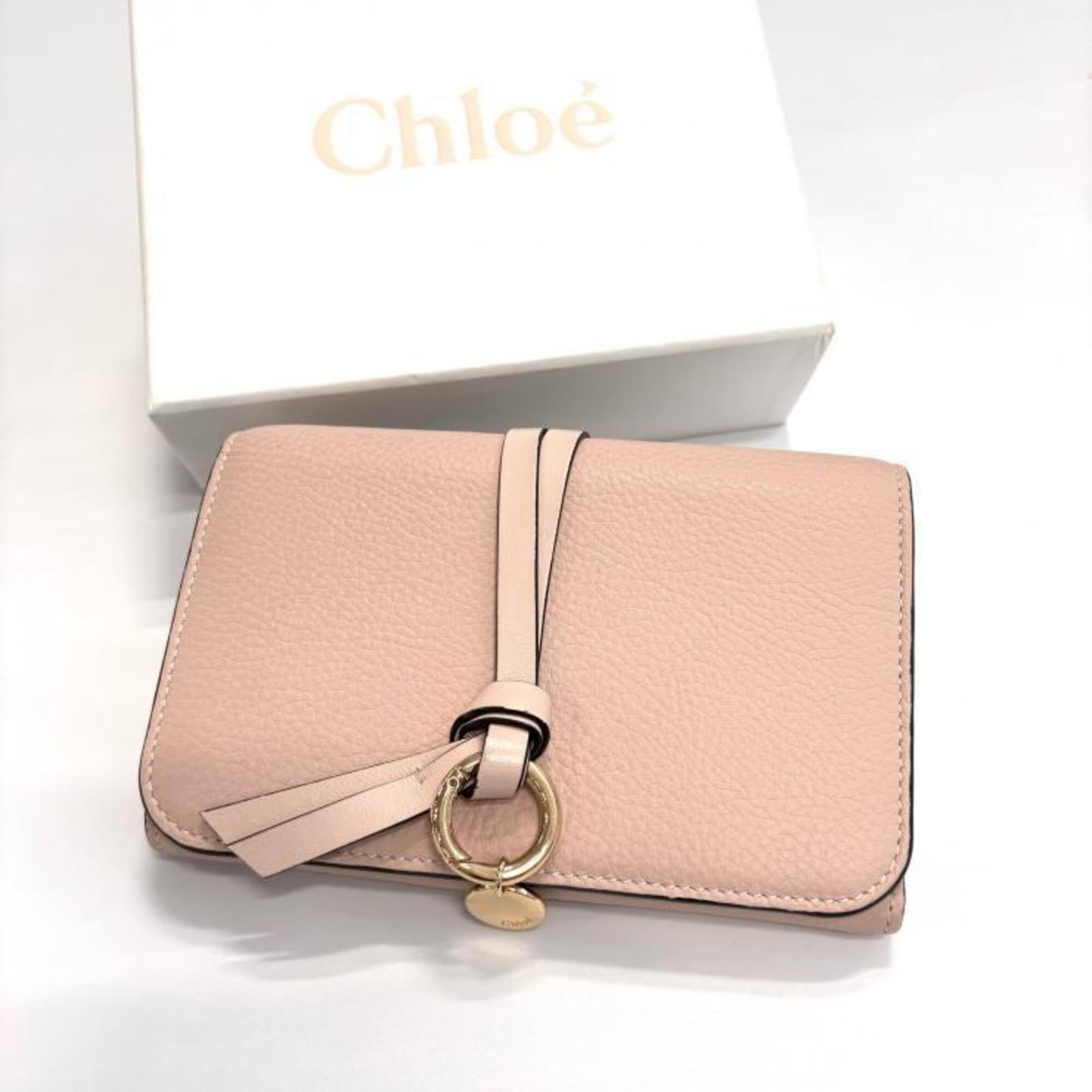 Chlo Wallet (Tri-Fold): Chlo Wallet (Tri-Fold) Tri-fold wallet with classic beige and pink color options, measuring 10cm x 15.1cm x 2cm in size, offering a practical and stylish storage solution for everyday essentials. The