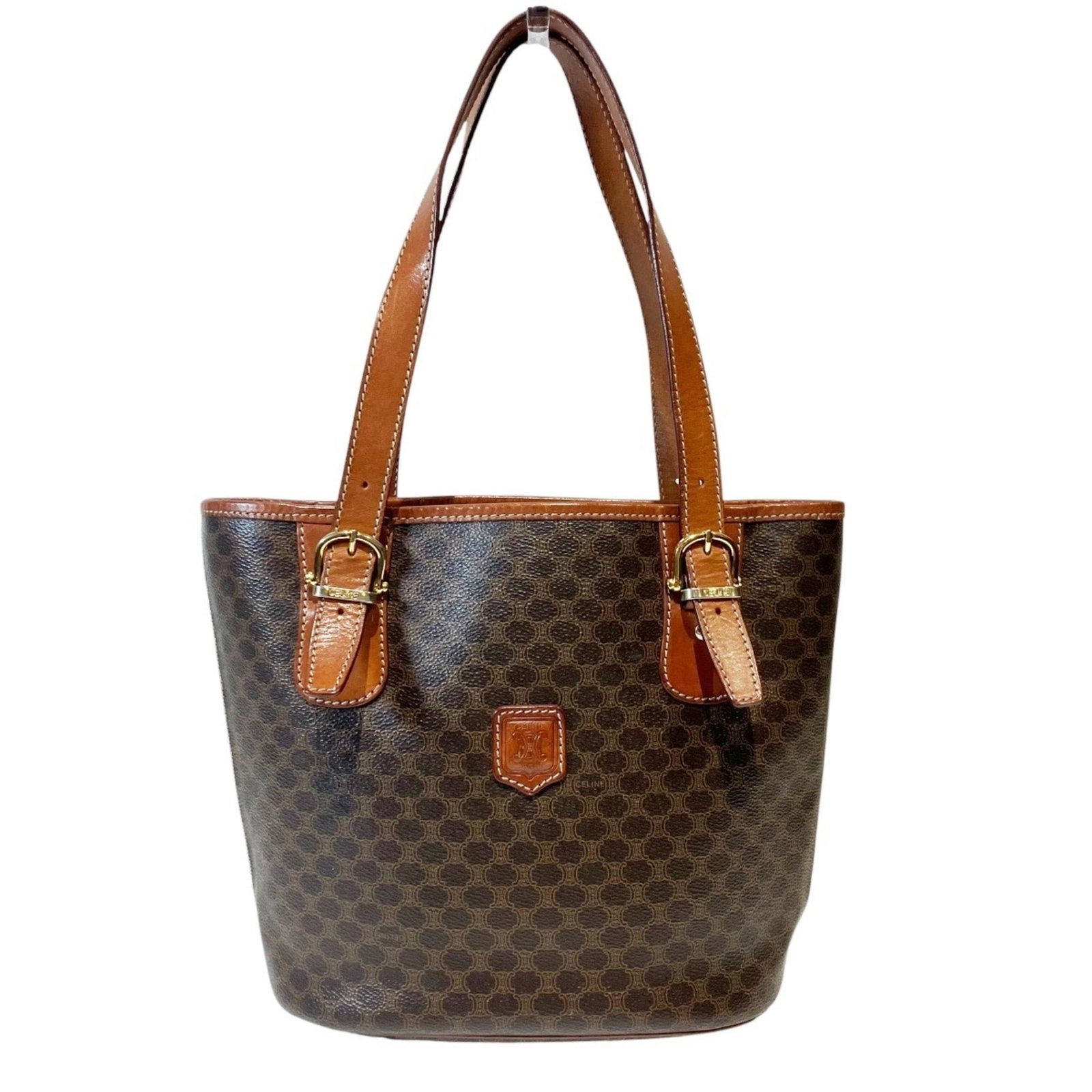 Canvas Pvc Tote Celine: Canvas Pvc Tote Celine Canvas and PVC construction for a durable tote bag. The brown color and compact size make it a practical choice for daily use, measuring 23.5cm x 24.5cm x 12.5cm. Item Specifics