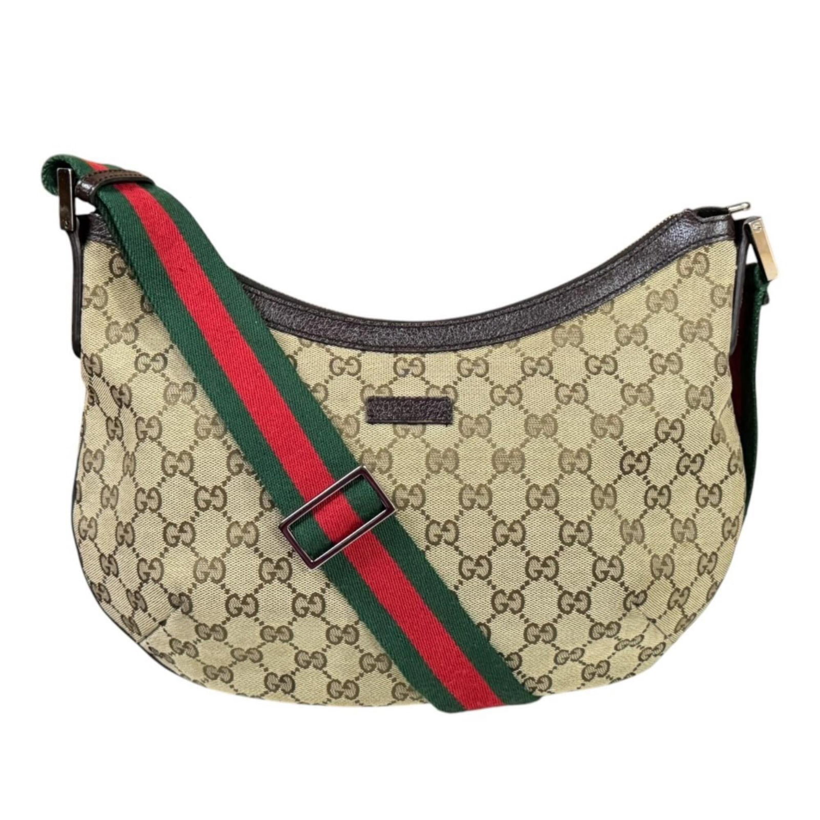 Gucci Handbag Shoulder Bag Gg Canvas: Gucci Handbag Shoulder Bag Gg Canvas Gucci's iconic GG canvas design takes center stage in this stylish shoulder bag, crafted from high-quality beige brown material. With its spacious interior and adj