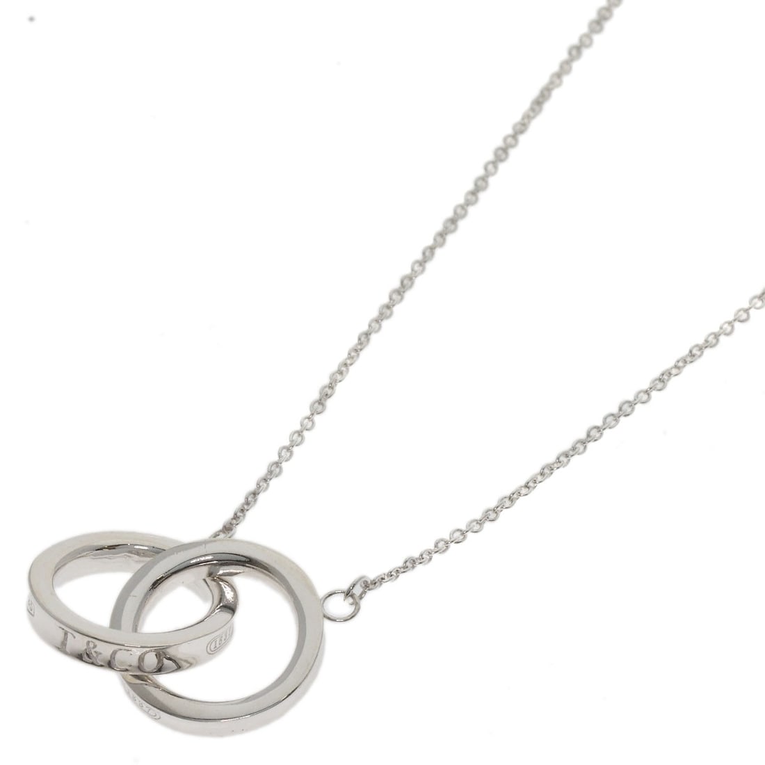 Interlocking Necklace Tiffany & Co. Silver: Interlocking Necklace Tiffany & Co. Silver Tiffany & Co. Silver Interlocking Necklace boasts sleek, modern design with a silver finish. Its 16.1-inch length makes it a versatile accessory for everyday