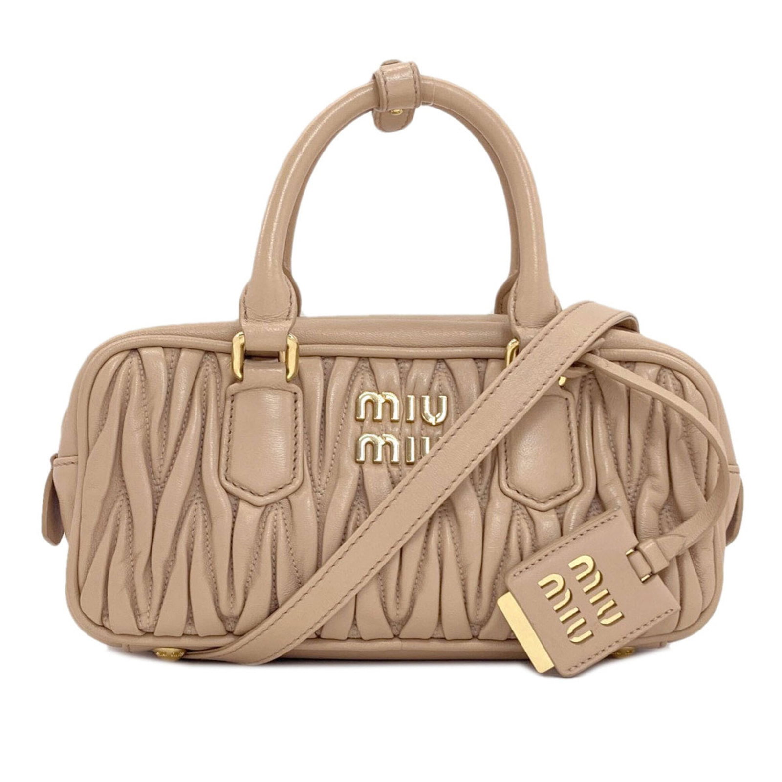Handbag Leather Miu: Handbag Leather Miu Brown leather Miu Miu handbag with dimensions 11.5cm x 23cm x 7.5cm, perfect for everyday carry. This stylish bag features high-quality leather construction and a classic design