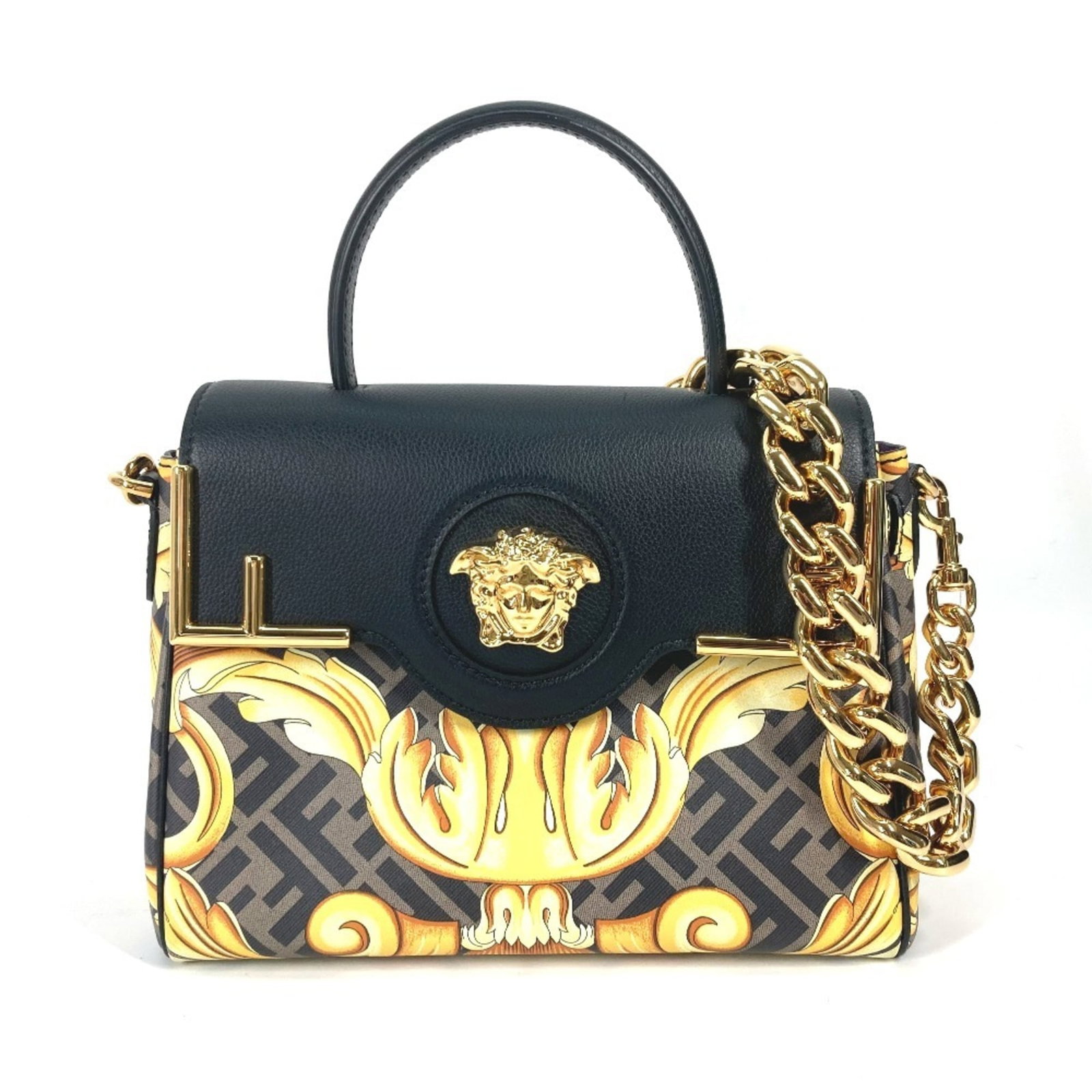 Handbag PVC Leather Shoulder Fendi: Handbag PVC Leather Shoulder Fendi PVC and leather combine in this Fendi shoulder bag, featuring a sleek black design with brown accents. The bag comes with a dust bag and adjustable shoulder strap