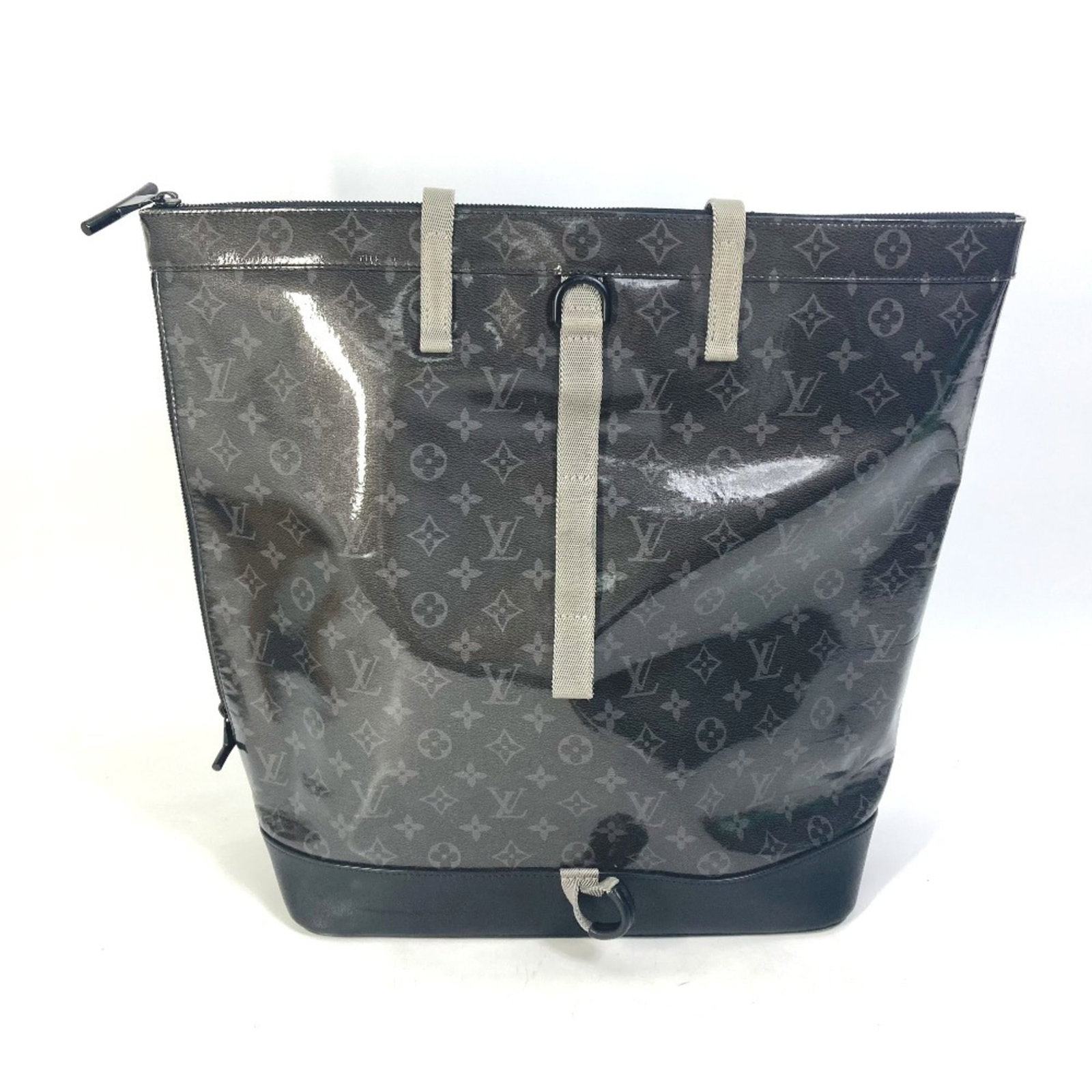 Louis Vuitton Backpack Handbag Tote Bag Monogram Eclipse: Louis Vuitton Backpack Handbag Tote Bag Monogram Eclipse Monogram Eclipse backpack tote bag from Louis Vuitton, featuring a striking black and monogram pattern. This stylish handbag boasts two open