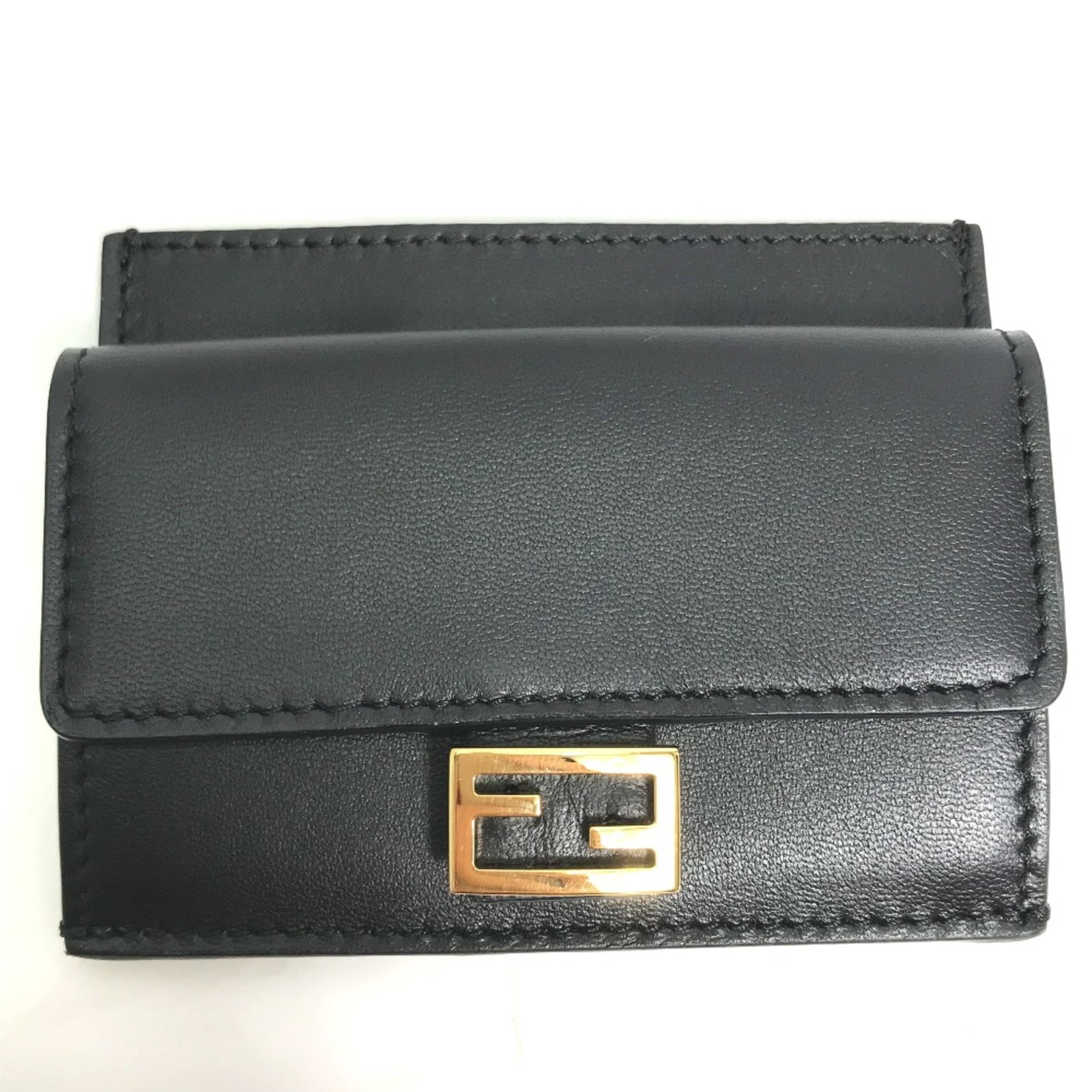 Coin purse leather case by Fendi: Coin purse leather case by Fendi Small, sleek, and sophisticated, this black leather coin purse case by Fendi measures 9.5cm x 7.5cm in width and height, with a compact size of 3.7cm x 3.0cm for