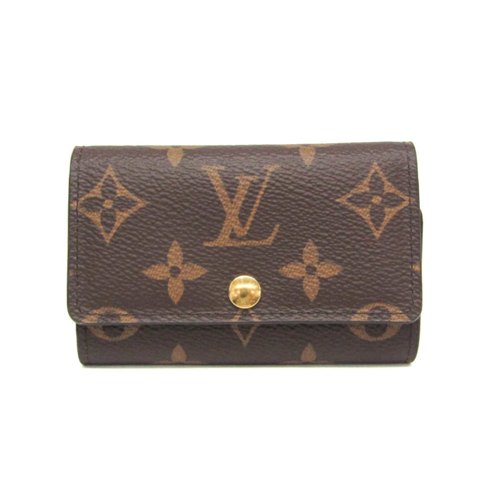 Vuitton Louis Keycase Monogram: Vuitton Louis Keycase Monogram The iconic Louis Vuitton Monogram Keycase, crafted in rich brown leather with the signature interlocking M pattern. This functional key holder features six secure hooks