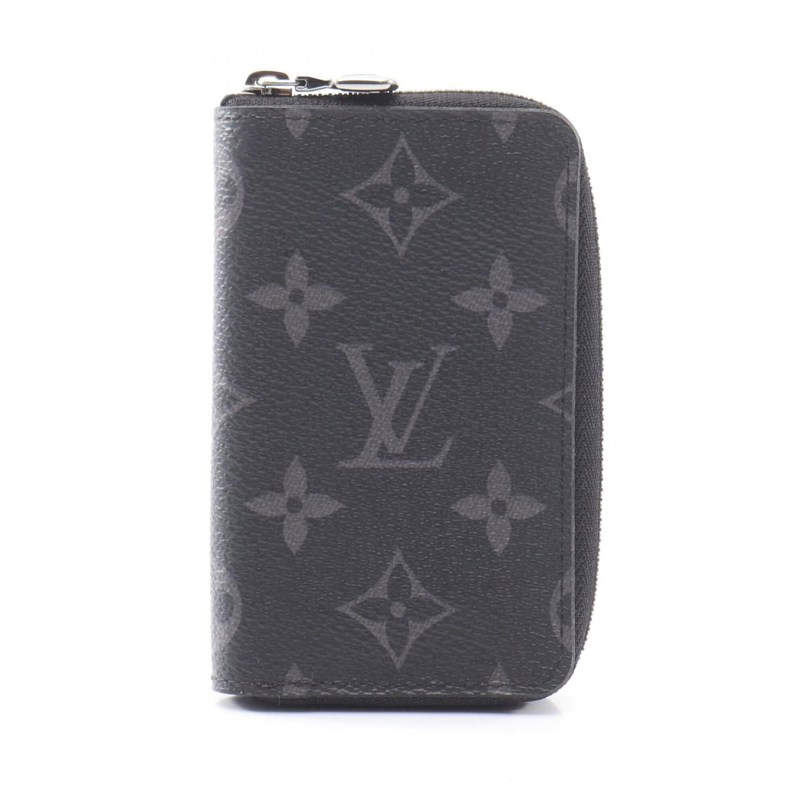 Louis Vuitton Coin Purse/ Coin Case Pvc: Louis Vuitton Coin Purse/ Coin Case Pvc Black Louis Vuitton Monogram Eclipse Coin Purse/ Coin Case made from PVC measures 12cm x 7cm x 2cm. This sleek and compact design features the iconic Monogram E