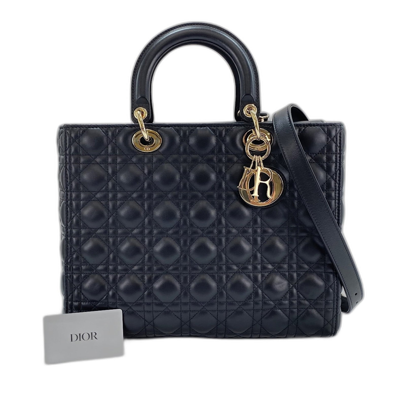 Handbag Christian Dior Leather: Handbag Christian Dior Leather This black Christian Dior Lady Dior leather handbag boasts classic design with clean lines and elegant proportions, measuring 25cm x 32cm x 12cm. The luxurious leather