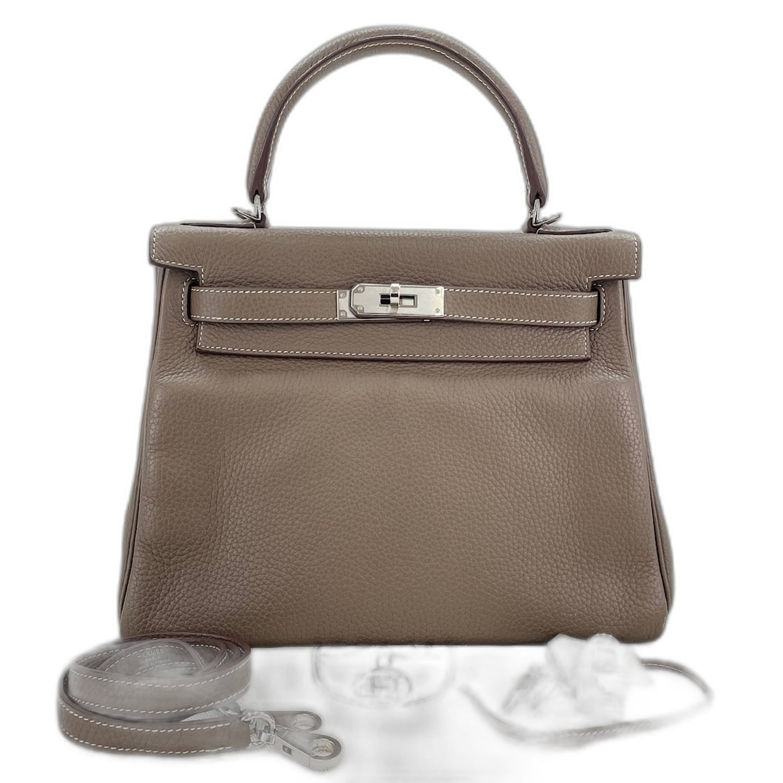 Handbag by Hermes: Handbag by Hermes Brown Kelly handbag by Hermes, featuring a classic flap closure and adjustable strap. Measuring 22cm x 27cm x 12cm, this stylish bag has a handle drop of 9.00cm and is made to last