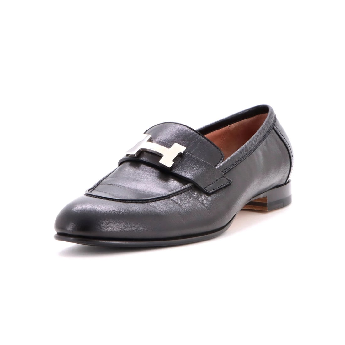 Women's leather loafers from Paris by Hermes: Women's leather loafers from Paris by Hermes Black leather loafers from Paris by Hermes, featuring creased and scuffed exterior with darkening and minor peeling in the interior. The shoes have