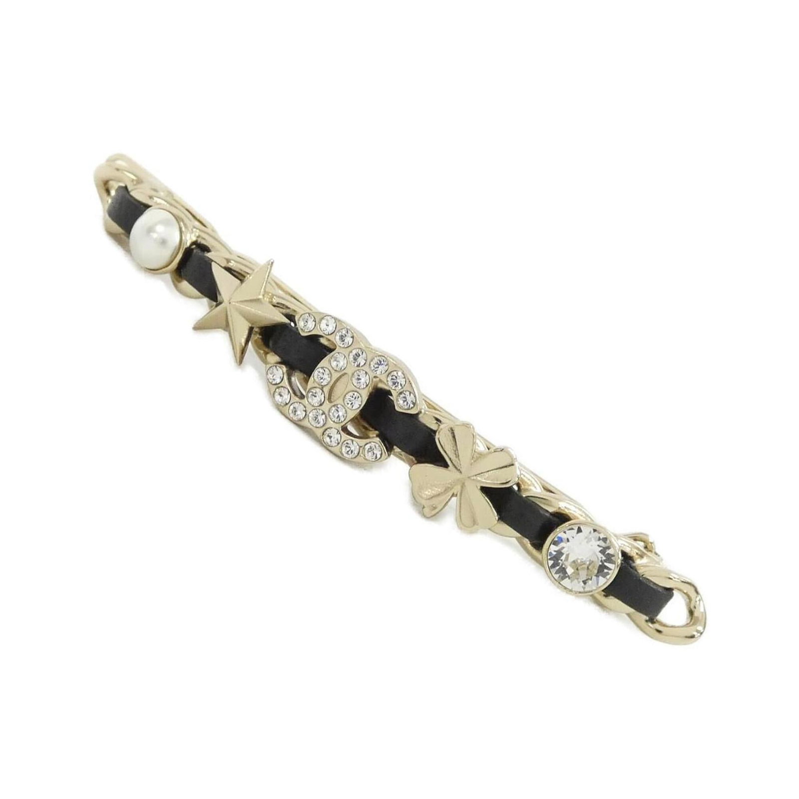 Barrette of Chanel: Barrette of Chanel Black and white crystal barrette from Chanel, measuring 1cm x 9cm. This elegant accessory features a striking design with crystal accents, adding a touch of sophistication to any