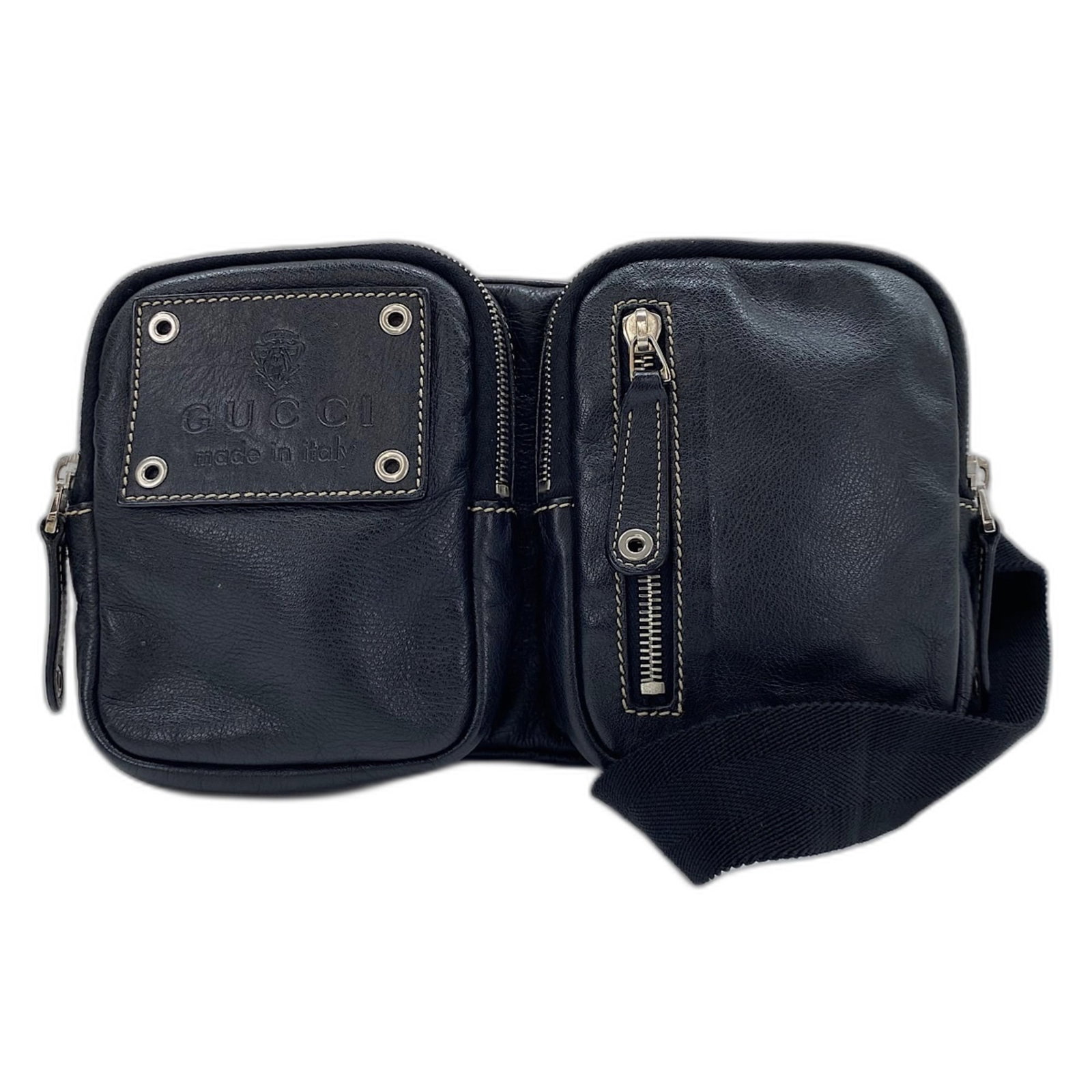 Fanny Pack Leather by Gucci: Fanny Pack Leather by Gucci Black leather fanny pack by Gucci, measuring 15cm x 27cm x 4cm. The strap length is 88cm, adding a convenient touch to the design. This classic accessory bears a signature